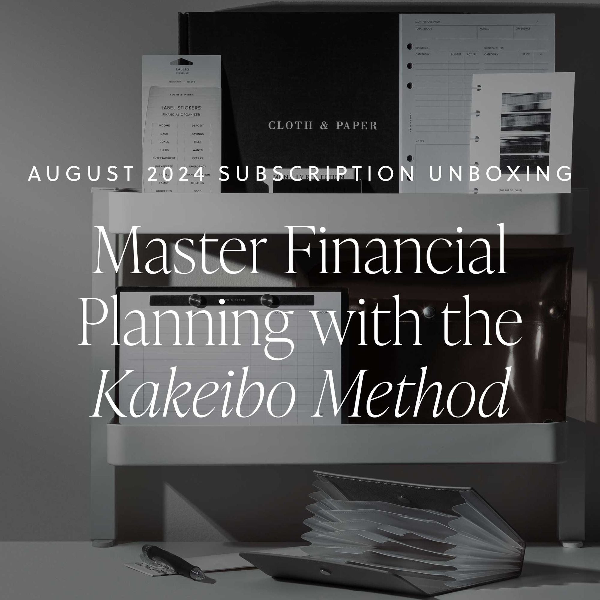 "An aesthetically pleasing image of all the items included in the August 2024 Intention Box, displayed on white desk shelves.