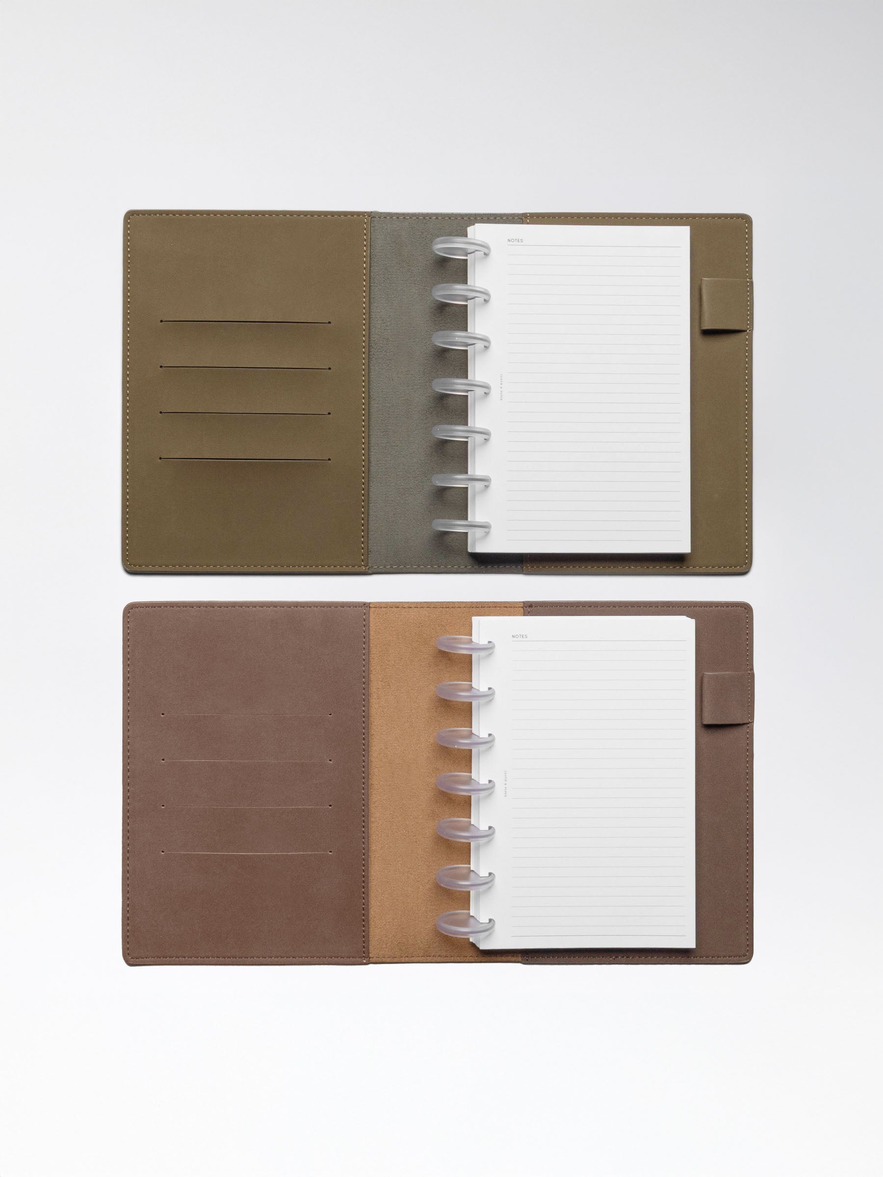 One Cipher and one Espresso folio displayed opened on a neutral background. Discbound planner systems are shown in use in each folio.