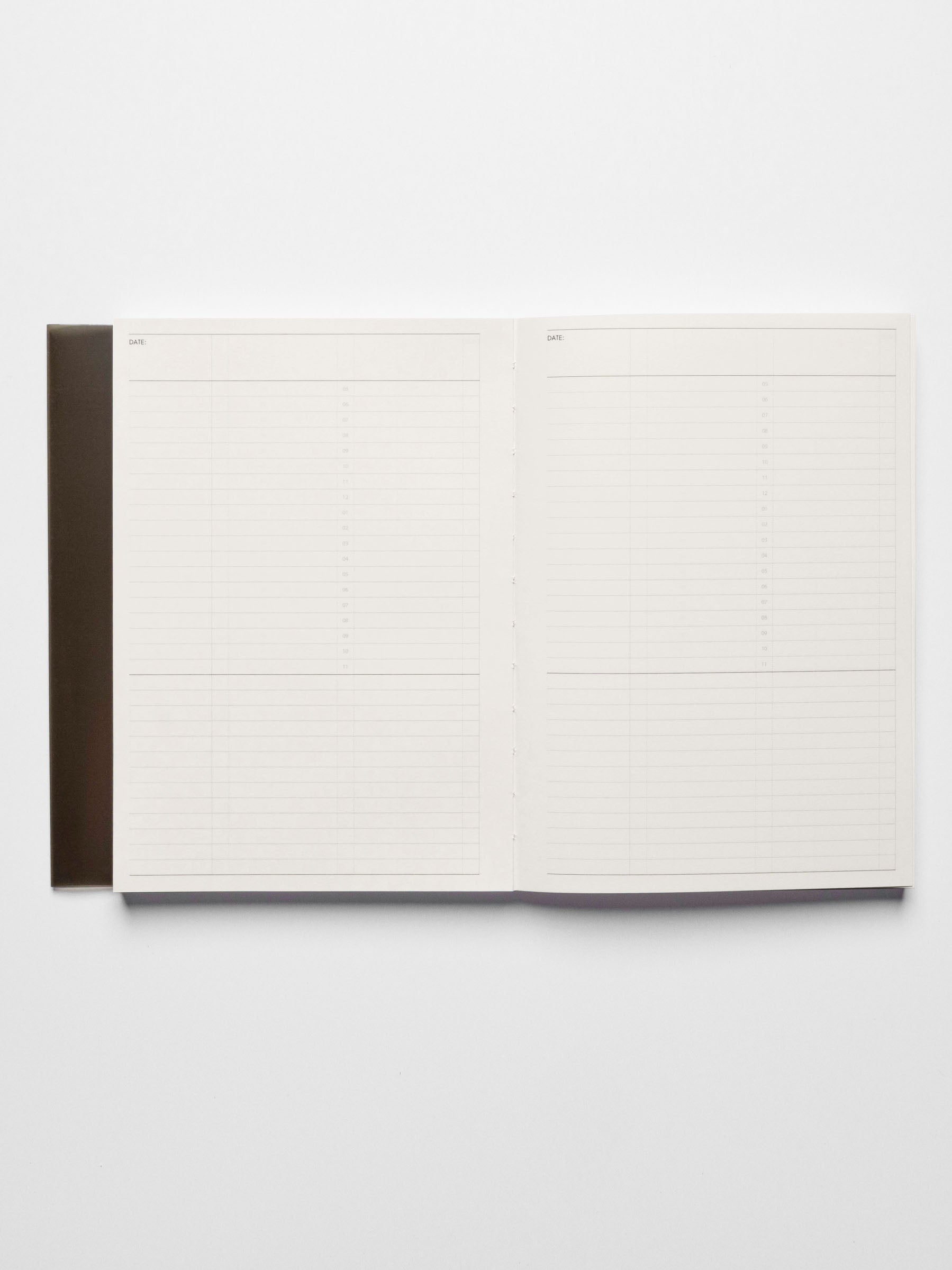 A5 notebook displayed open on a neutral background.