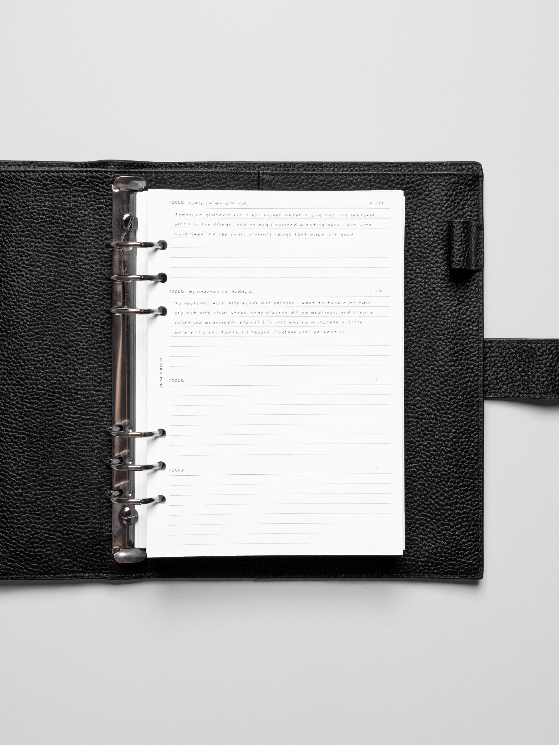Insert in use inside a black leather planner.