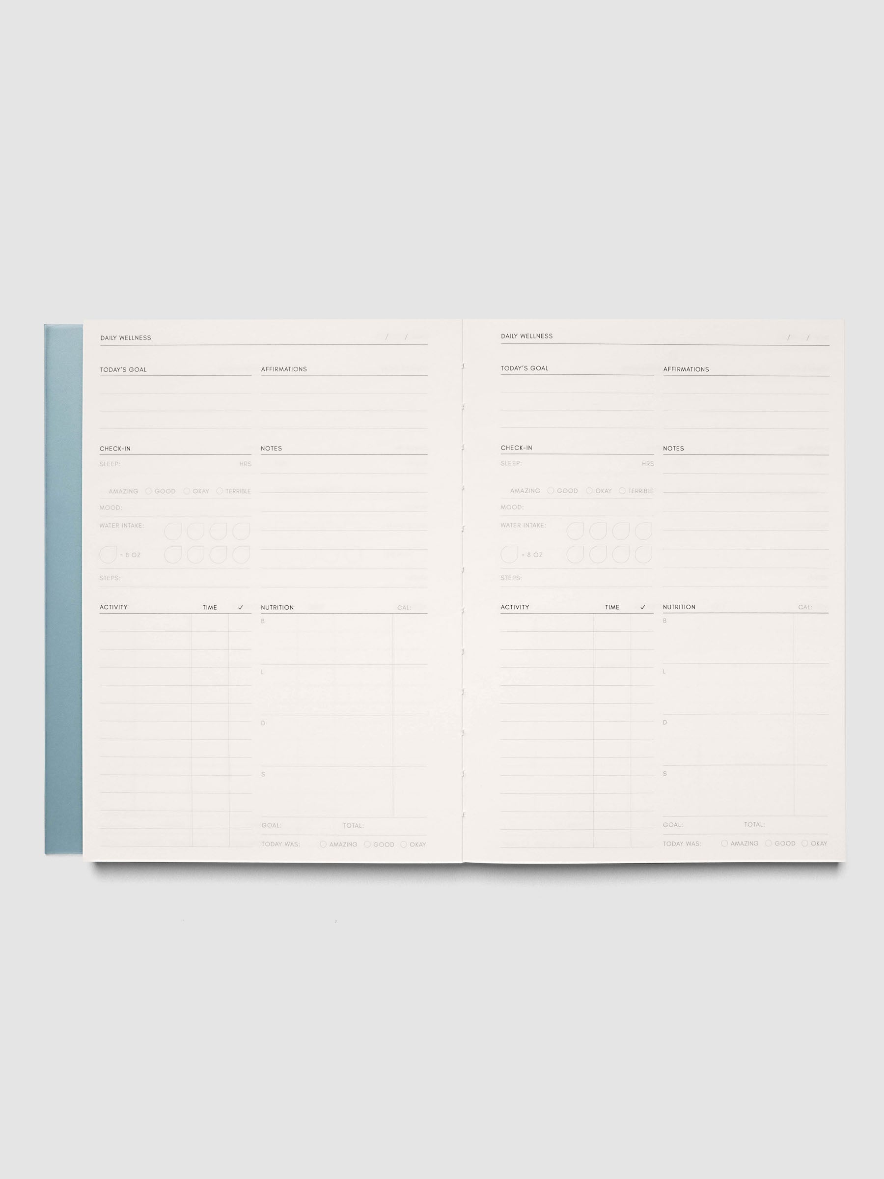 Perfect Bound Notebook | A5 | Daily Wellness shown open and laid flat, both pages showing the daily wellness layout in columns