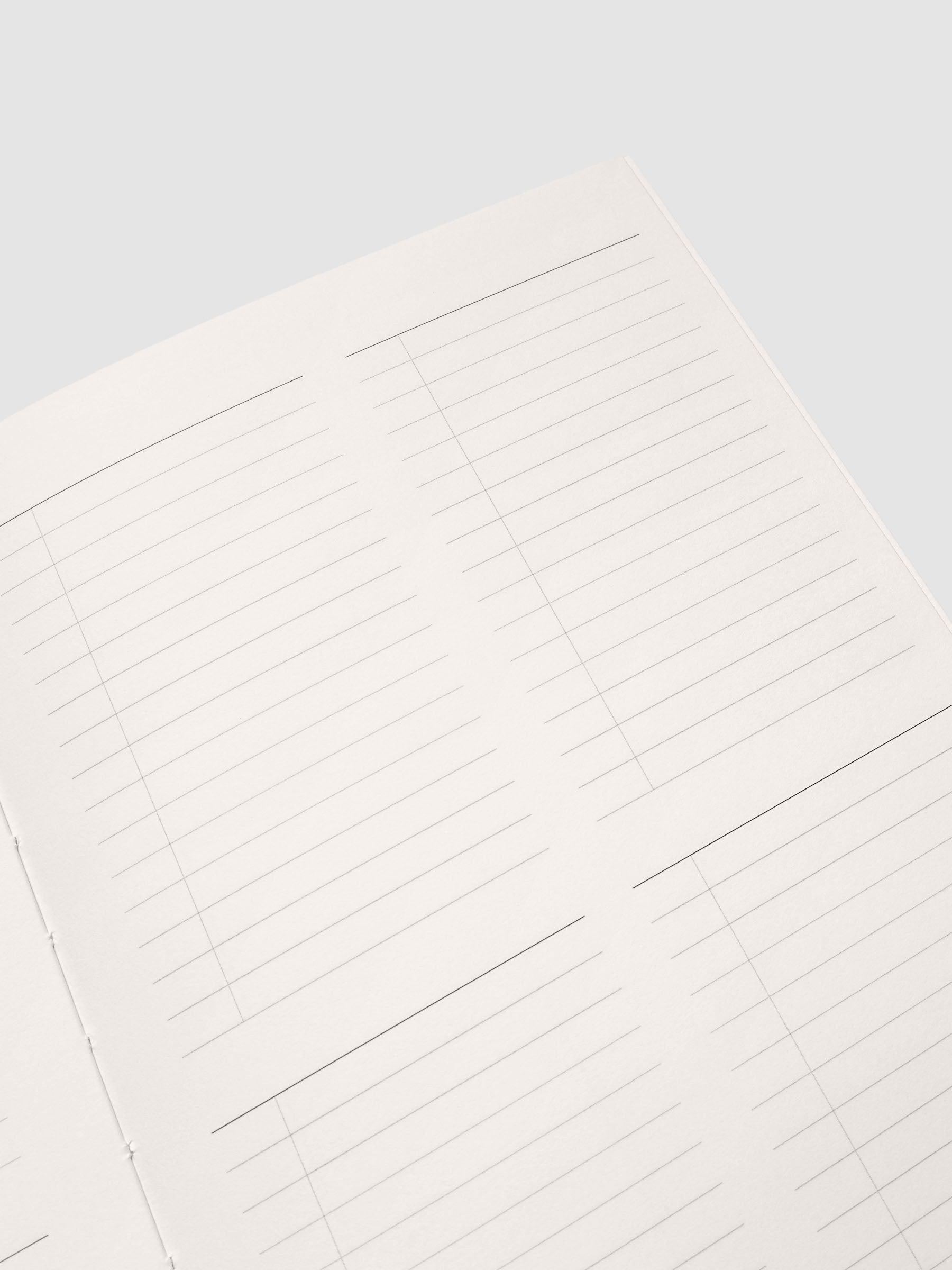 Close up of the Perfect Bound Notebook | A5 | Quad Checklist pages at an angle, showing the four section checklist grid