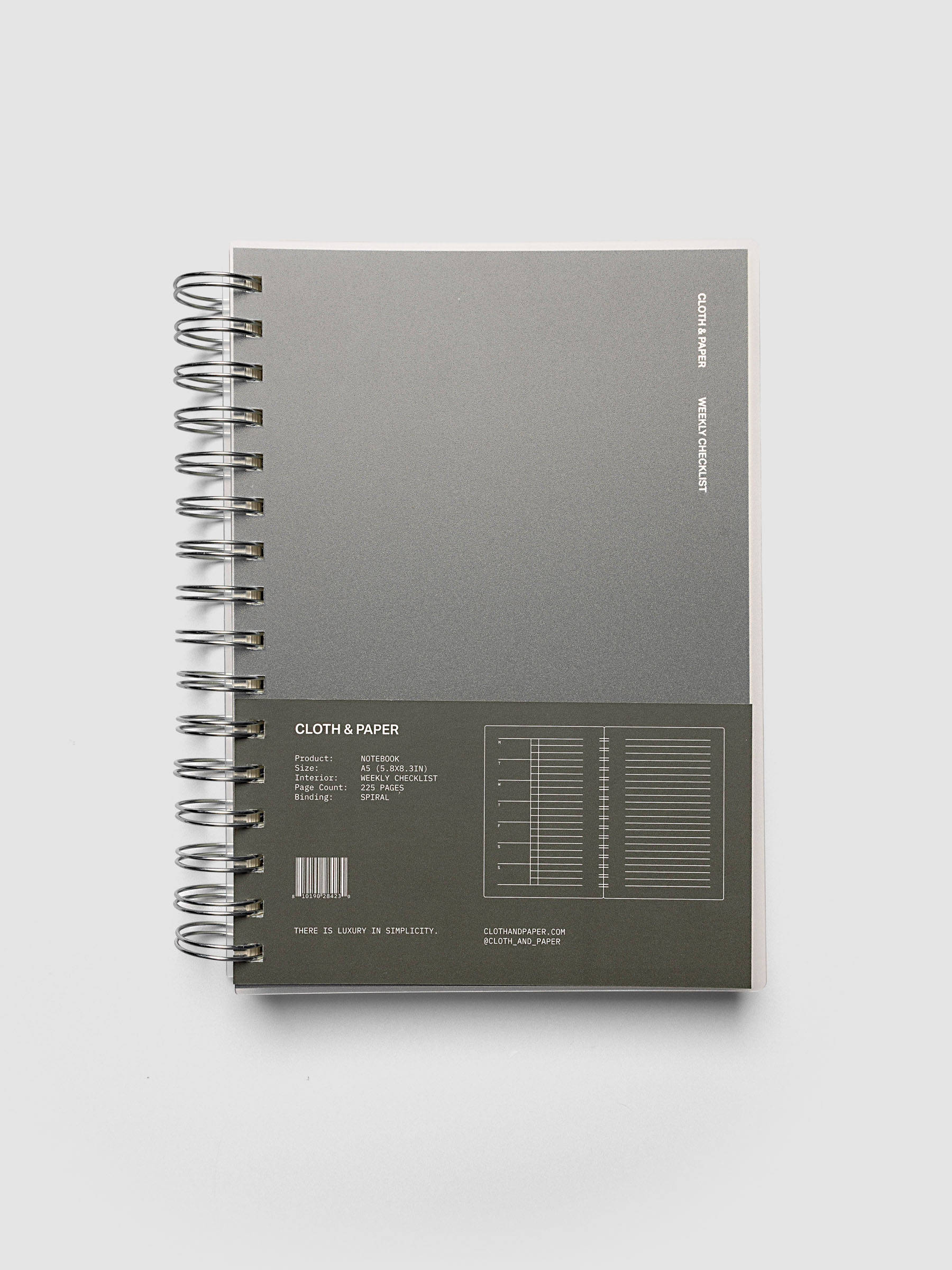 Spiral Notebook | A5 | Weekly Checklist shown closed on a neutral background, dark olive cover with a printed layout key and silver spiral binding
