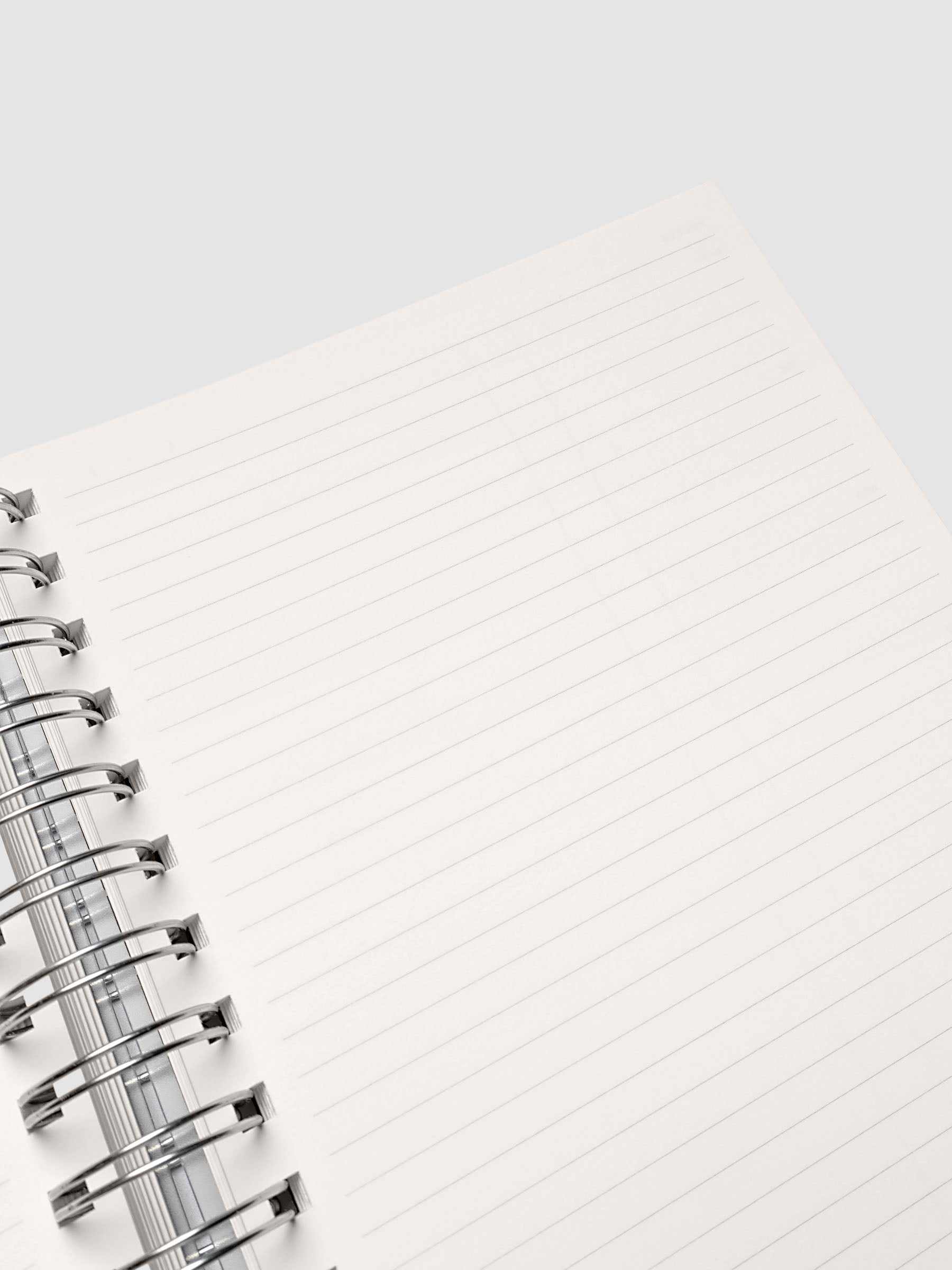 Close up of the Spiral Notebook | A5 | Weekly Checklist pages at an angle, showing ruled checklist lines beside the silver spiral binding