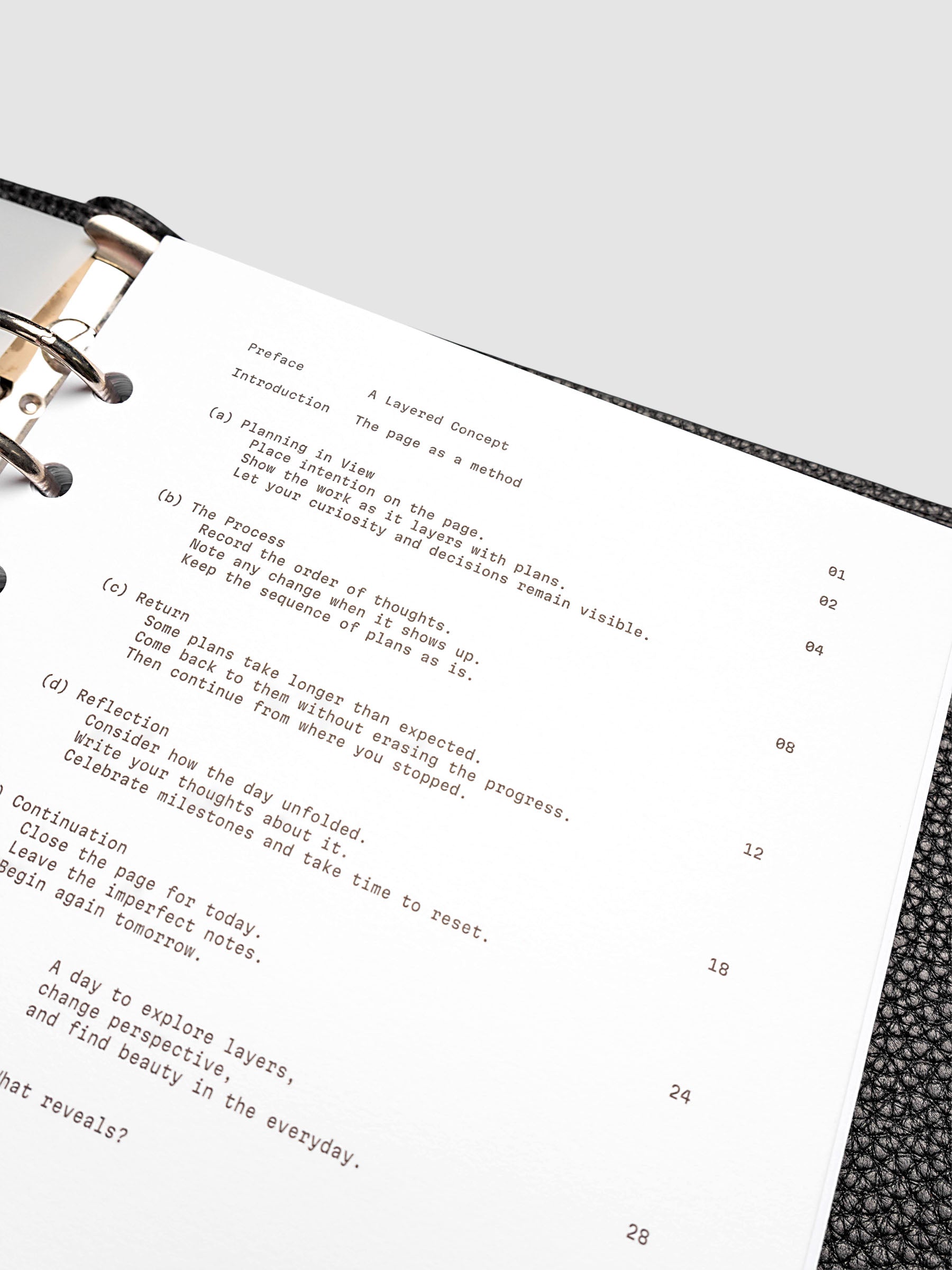 Continuation Planner Cover + Dashboard Set in A5 6-Ring Punch. Milky white frosted plastic cover with a spot gloss organic shape over a black-printed paper dashboard. Image 5 of 5.