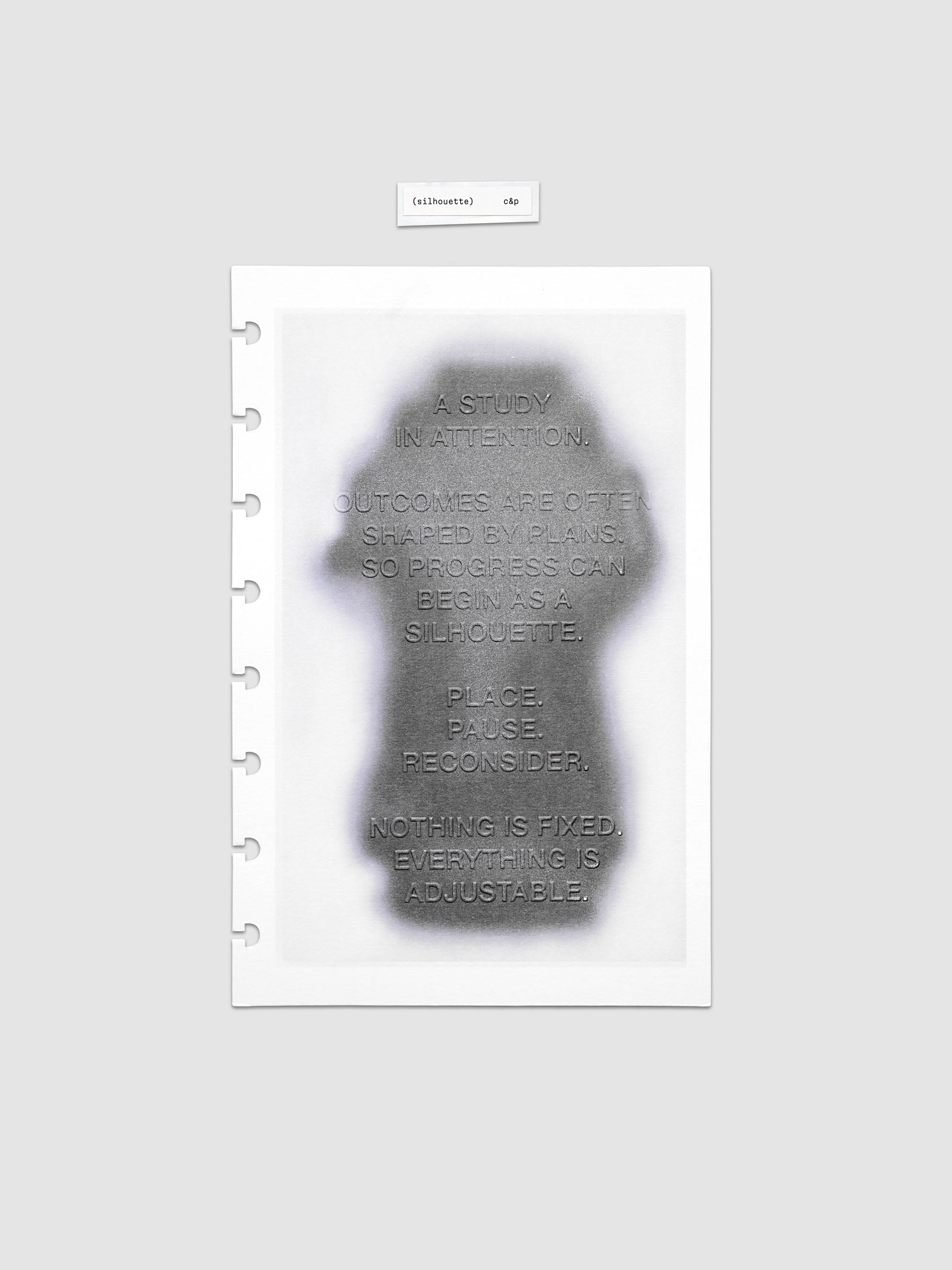 Silhouette Planner Dashboard in Half Letter 8-Disc Punch. Greyscale silhouette print with embossed text on paper. Image 1 of 2.