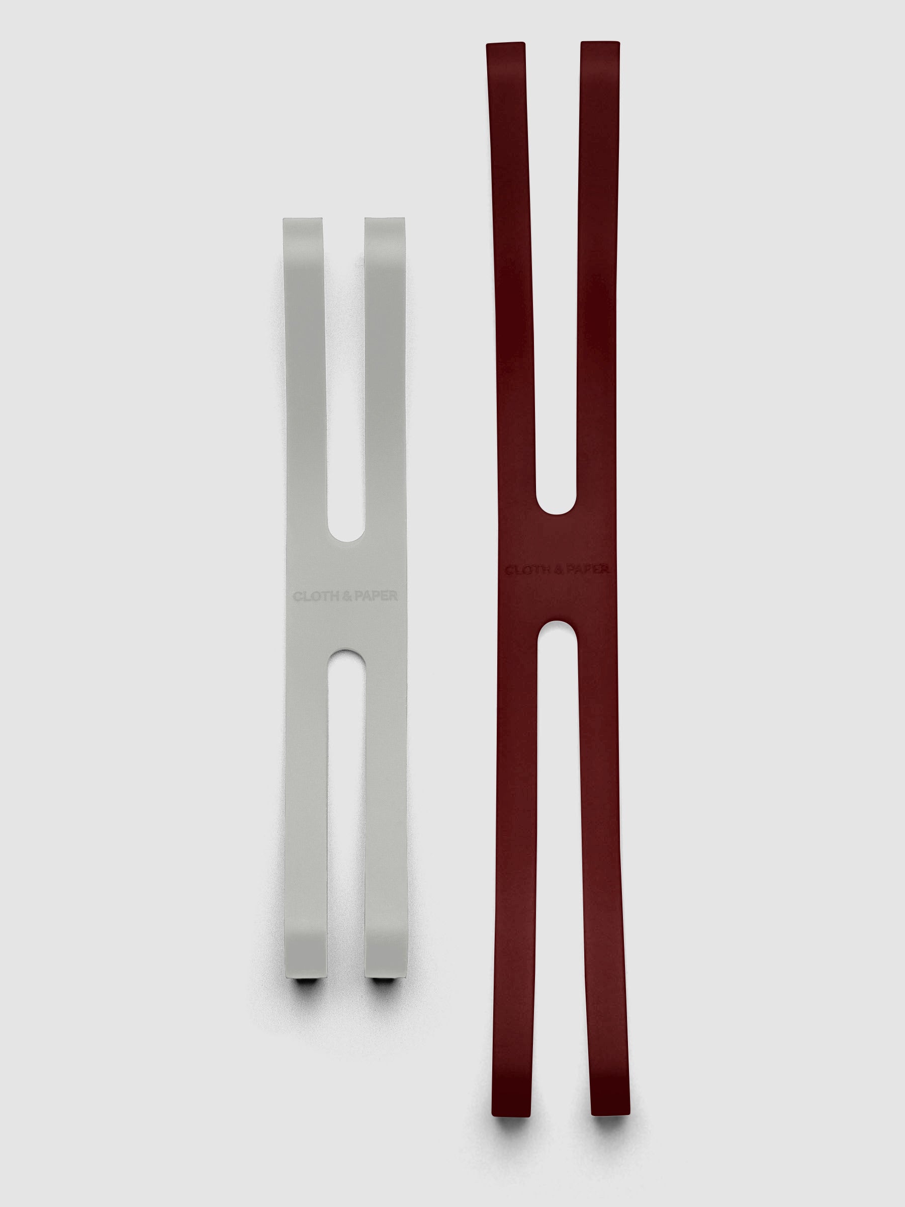 Small ash and large bordeaux planner closure bands shown side by side for size comparison.