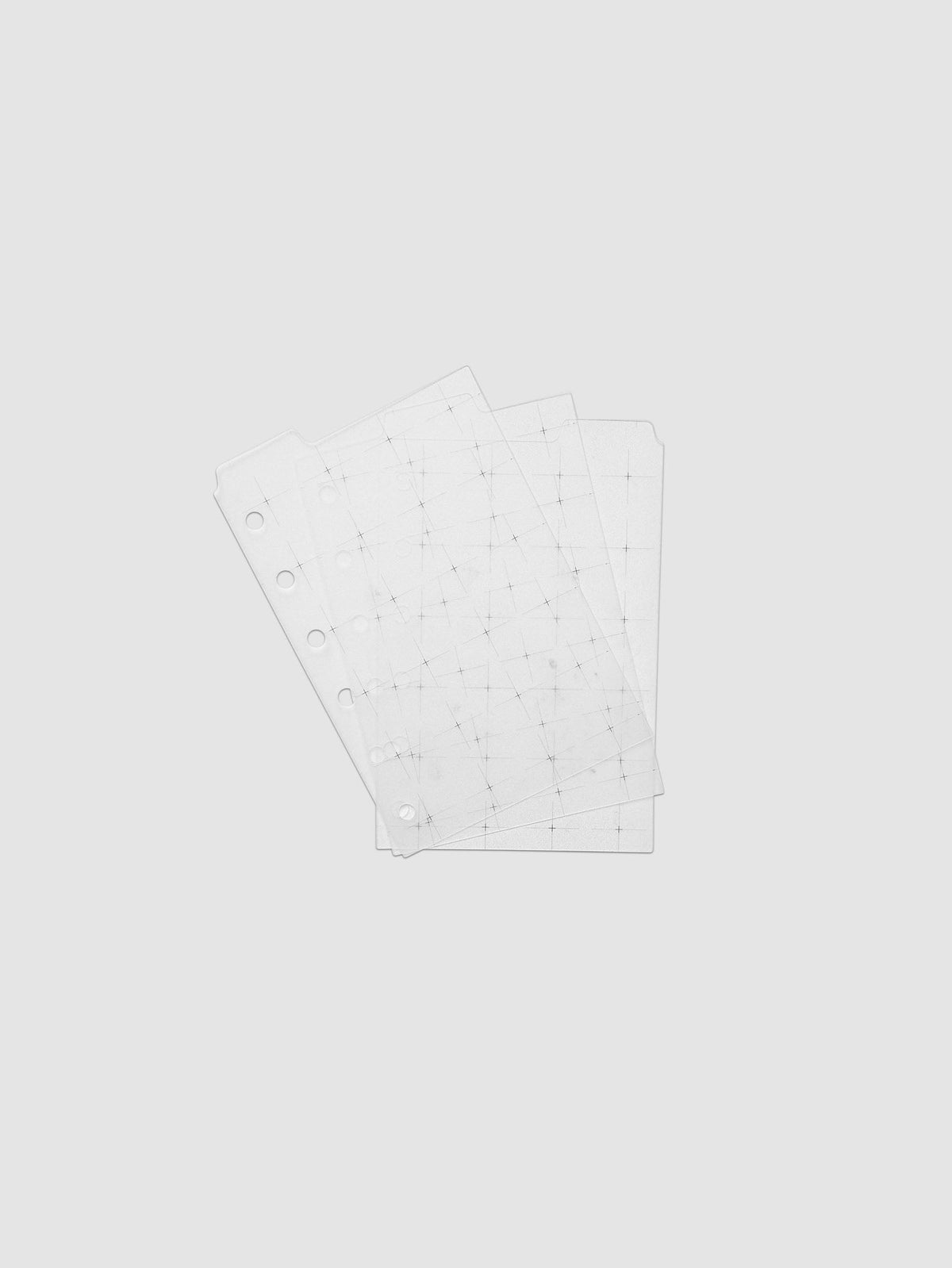 Grid Top Tab Dividers | Ultra-Thin, Pocket 6-Ring Punch, the three dividers fanned at an angle, black crosshair grid print visible through the overlapping sheets