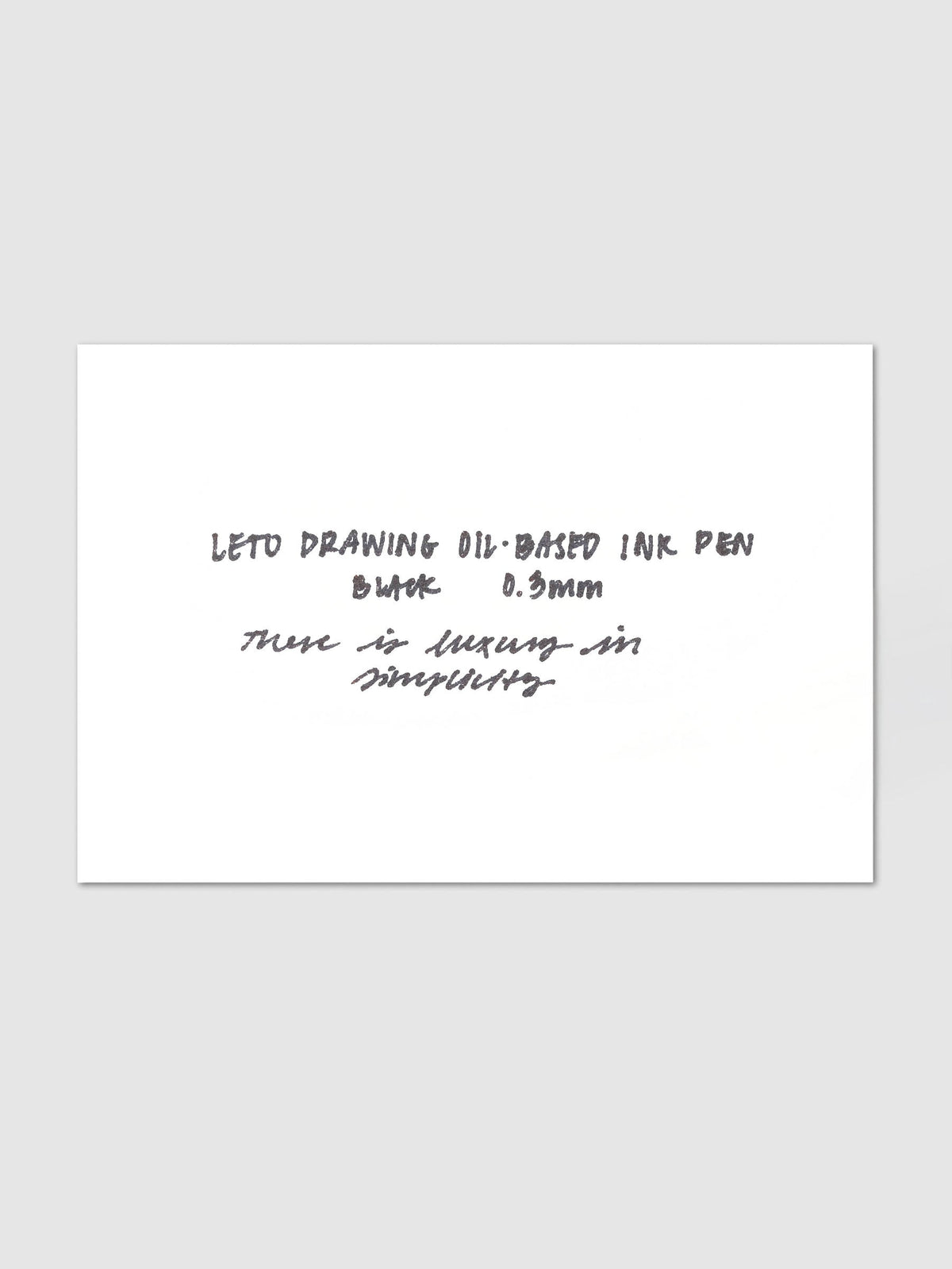 Leto Drawing Oil-Based Ink Pen, Black | 0.3 mm, white card on a light gray background carrying a black ink writing sample that names the pen and its tip size in print and script