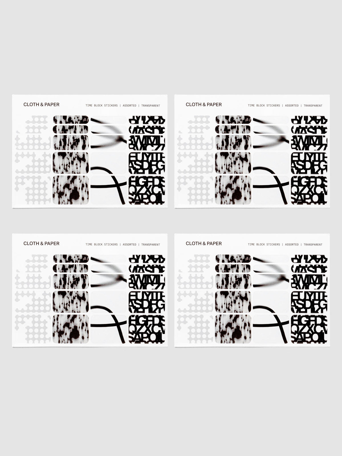 Time Block Stickers in Punched Holes, Blurred Ink, Blurred Line and Precision shown on a planner page