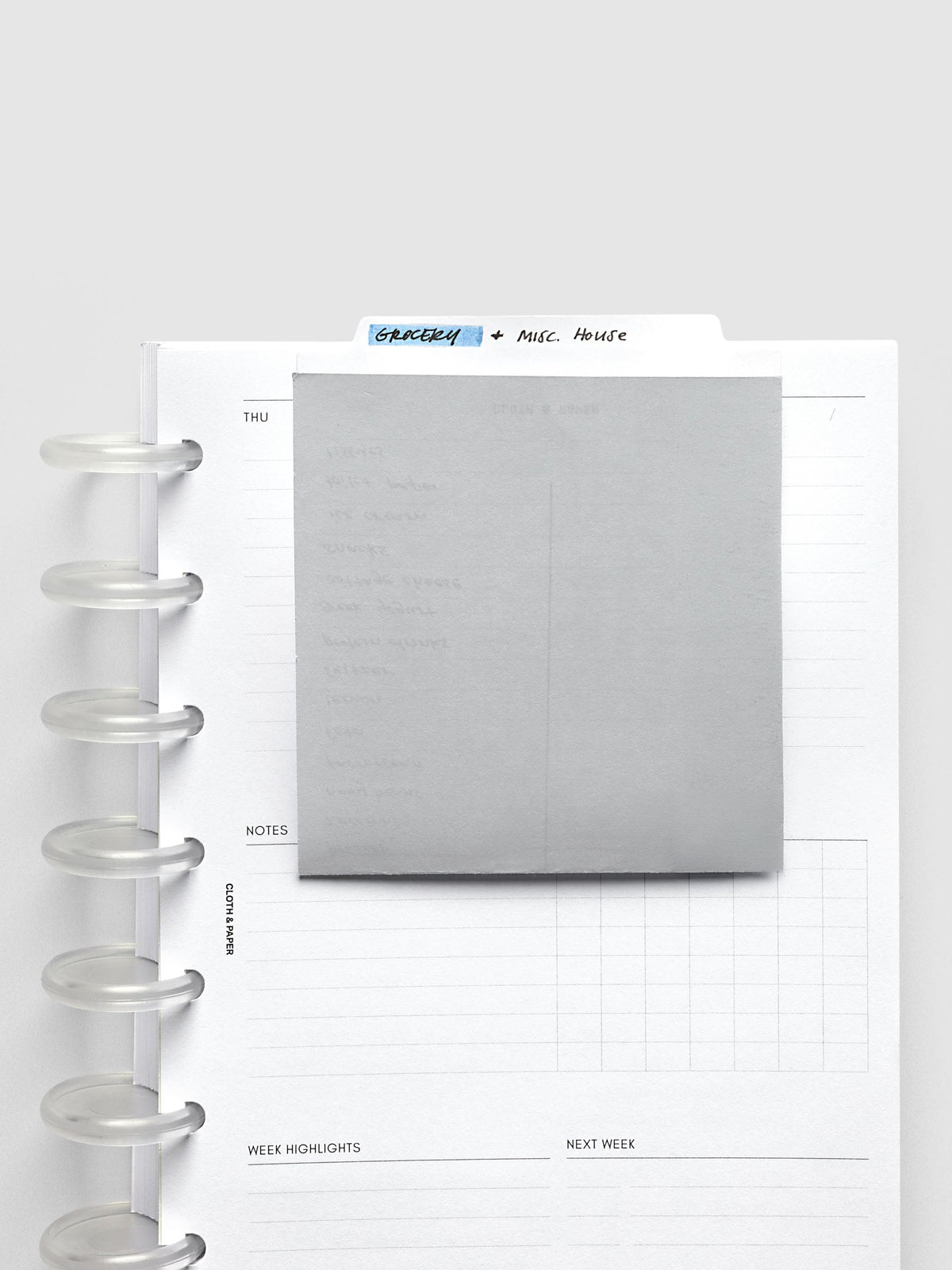Large Sticky Notes Tab Lined, note folded down over a weekly insert, the labeled tab rising above the page