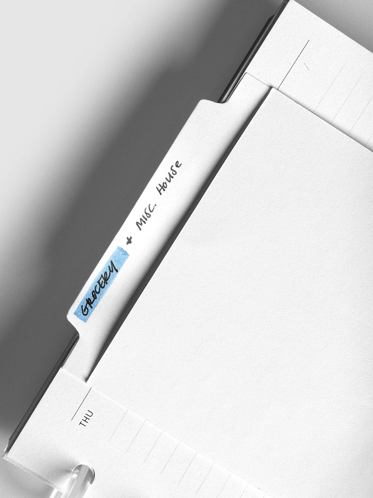 Large Sticky Notes Tab Lined, close-up of the tab labeled by hand
