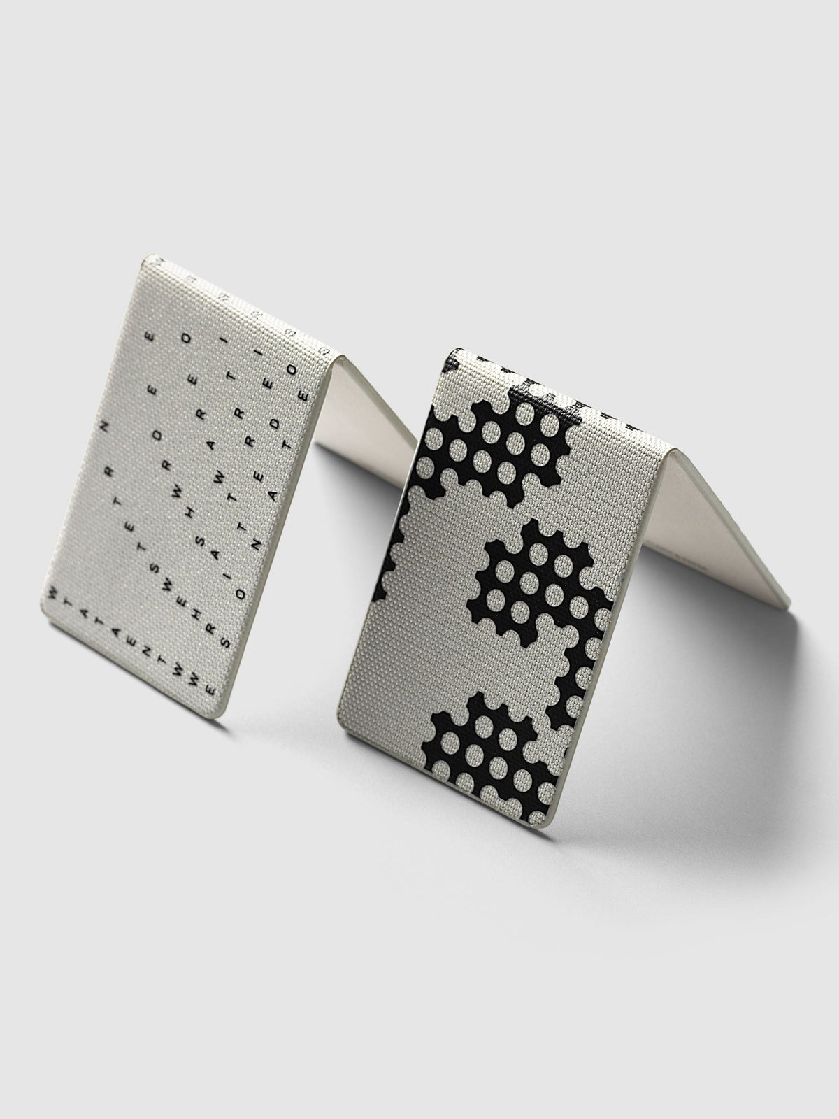 Magnetic Bookmarks Punched Holes & Margin, both bookmarks standing open like tents