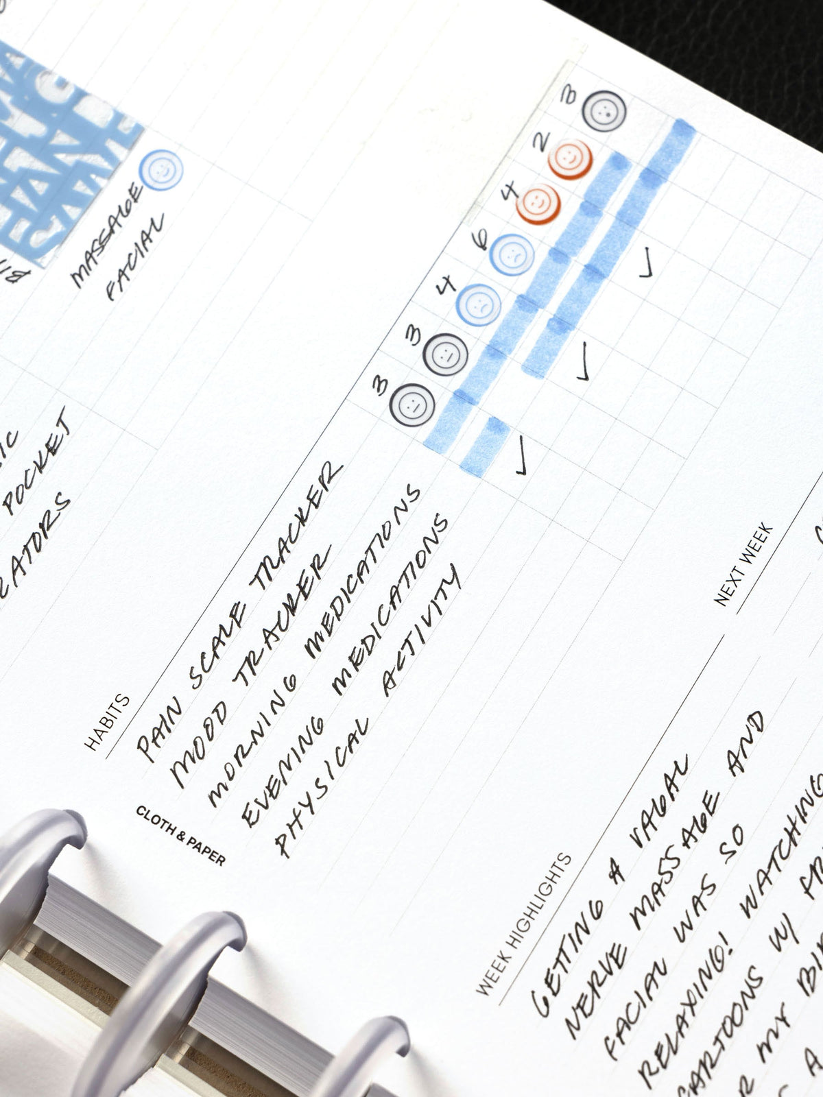 Weekly Essentials Planner Inserts, Half Letter 8-Disc Punch, close-up of the habit tracker filled in with color and the Week Highlights section