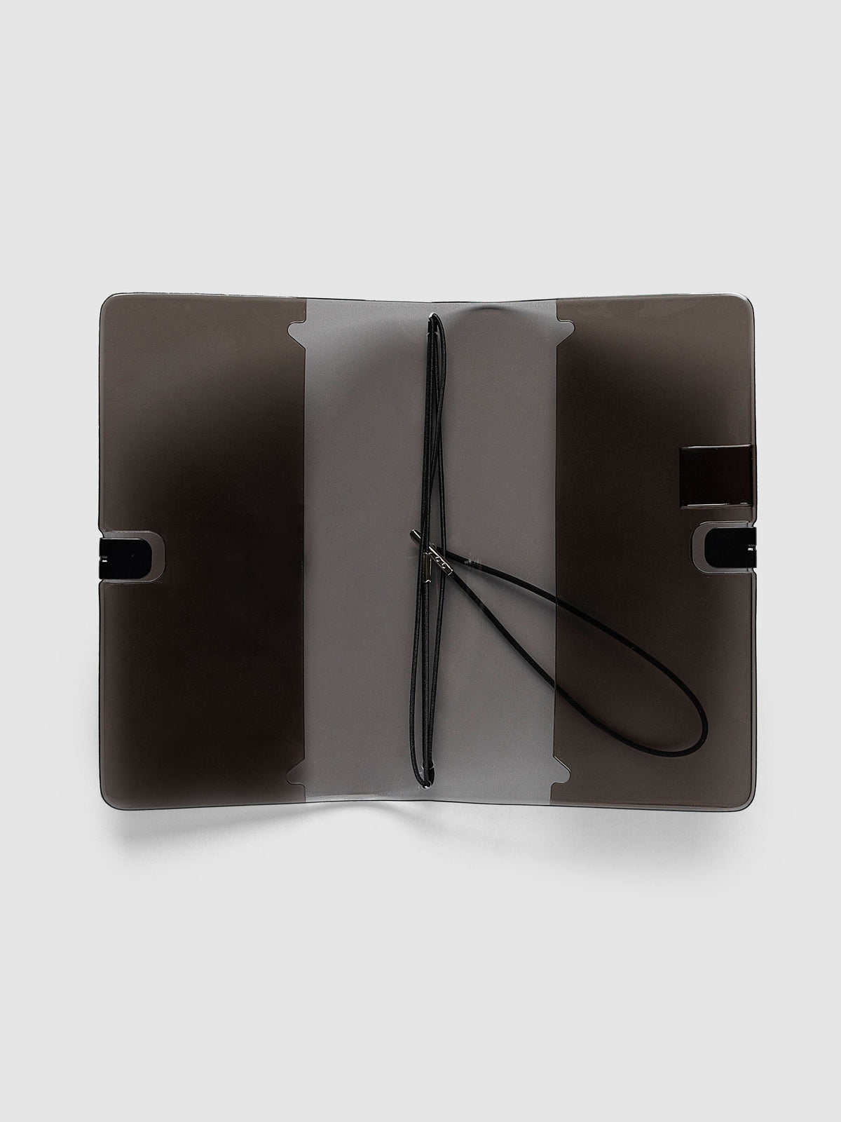 Image Duo Travel Cover, Pocket Plus, open flat showing the frosted center panel and black elastic insert bands with silver metal ends