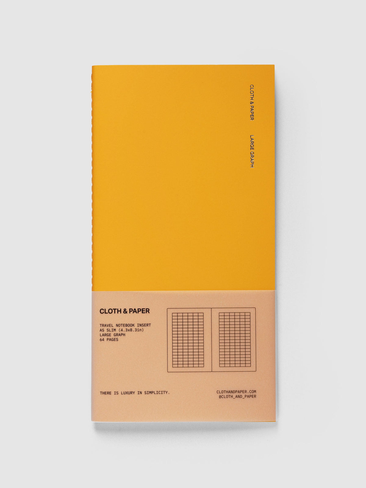 Large Graph Travel Notebook in Tangent, A5 Slim, orange cover with Cloth & Paper and Large Graph lettering and a peach paper band listing 64 pages