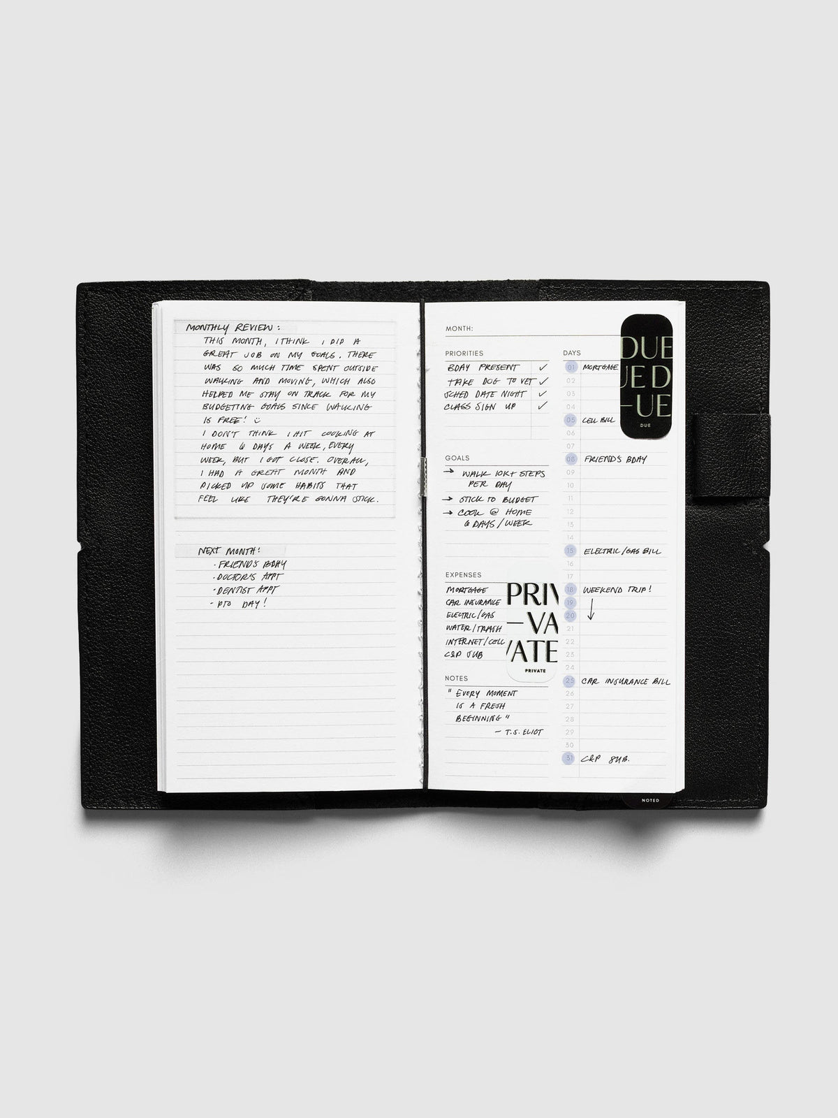 Monthly Overview Pocket Plus inside a black travel notebook cover, filled in with a monthly review, priorities, goals, expenses and bills by day, with Private and Due stickers