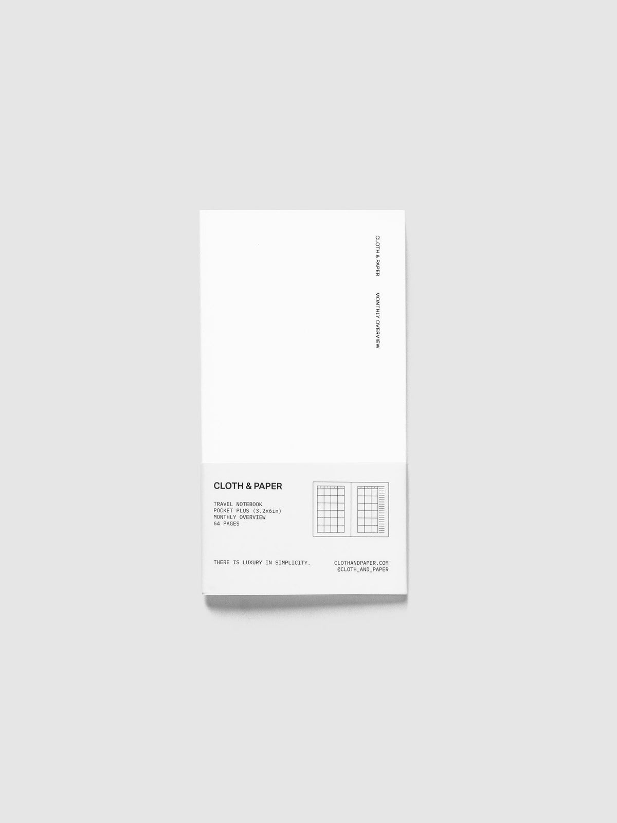 Monthly Overview Travel Notebook in Le Blanc, Pocket Plus, white cover with Cloth & Paper and Monthly Overview lettering and a white paper band listing 64 pages