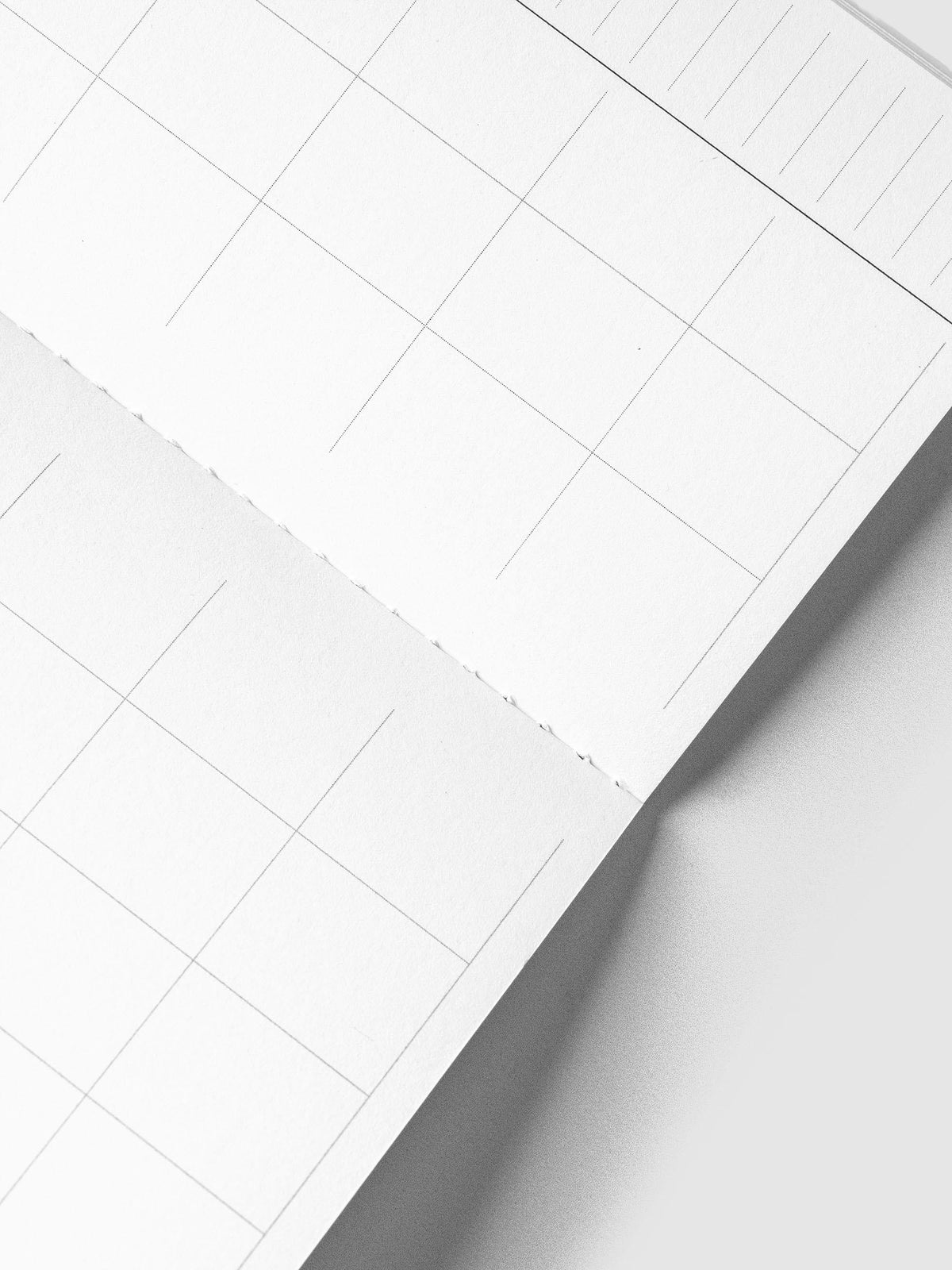 Close-up of the calendar grid and stitched binding inside the Monthly Overview Pocket Plus