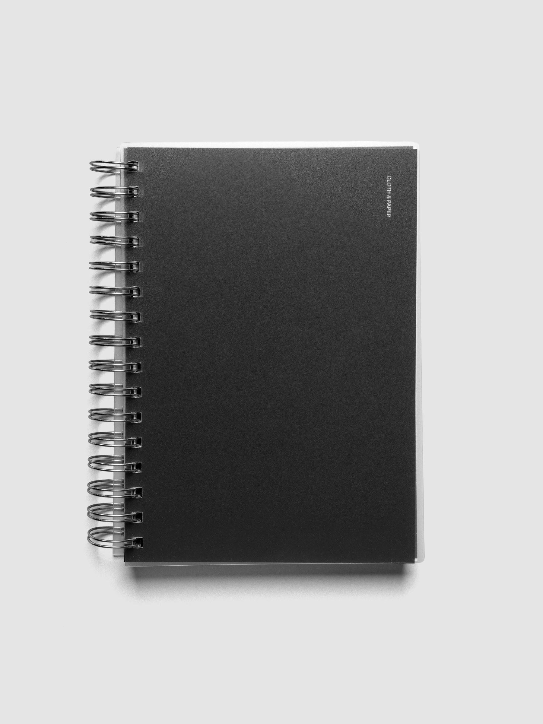 Spiral Notebook dashboard in the color Avant Garde shown in size A5 inside a notebook with the frosted transparent cover overlayed.