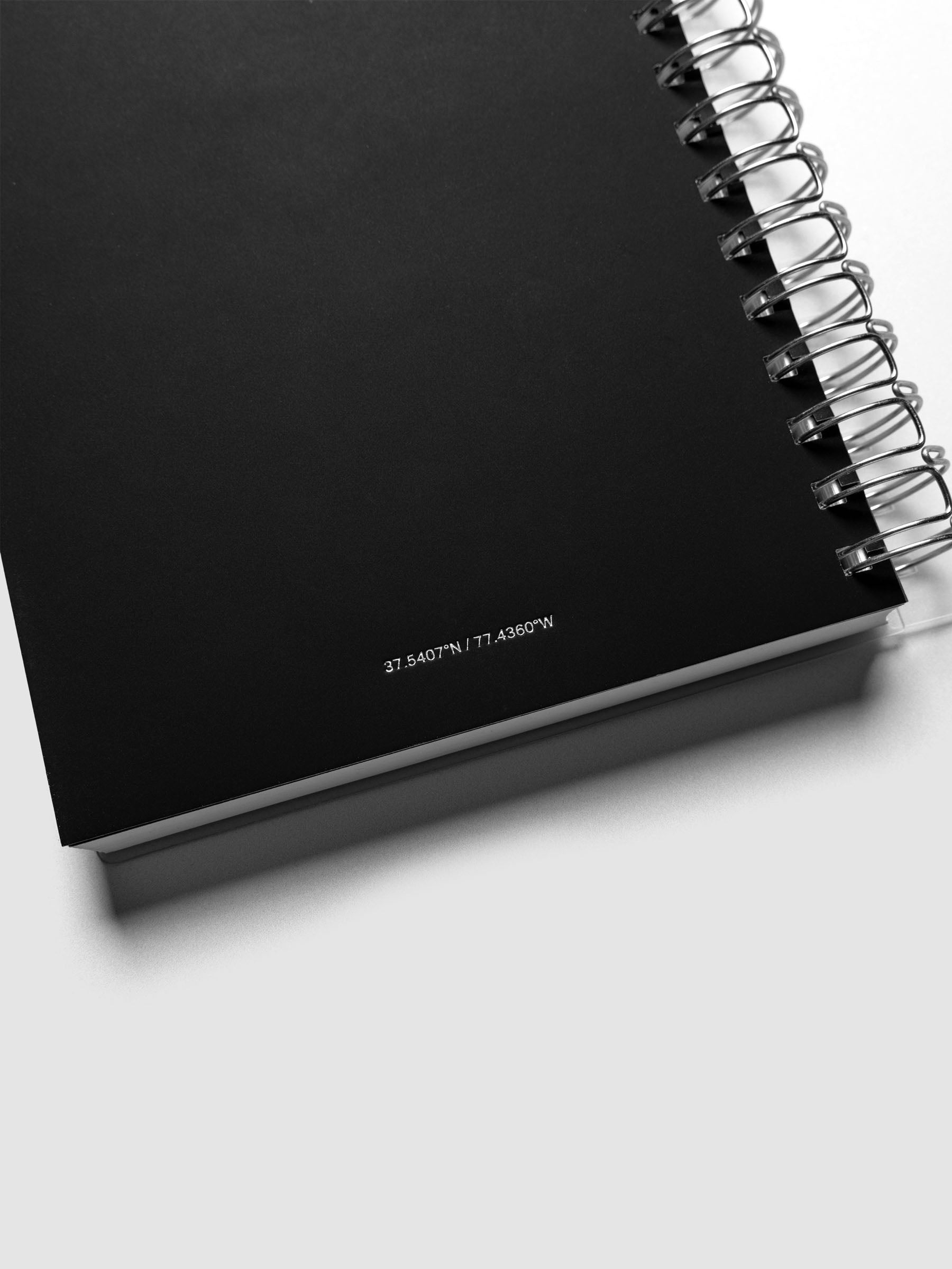 Detail view of the Spiral Notebook dashboard in the pattern Blurred Letters shown in size A5 against a neutral background.