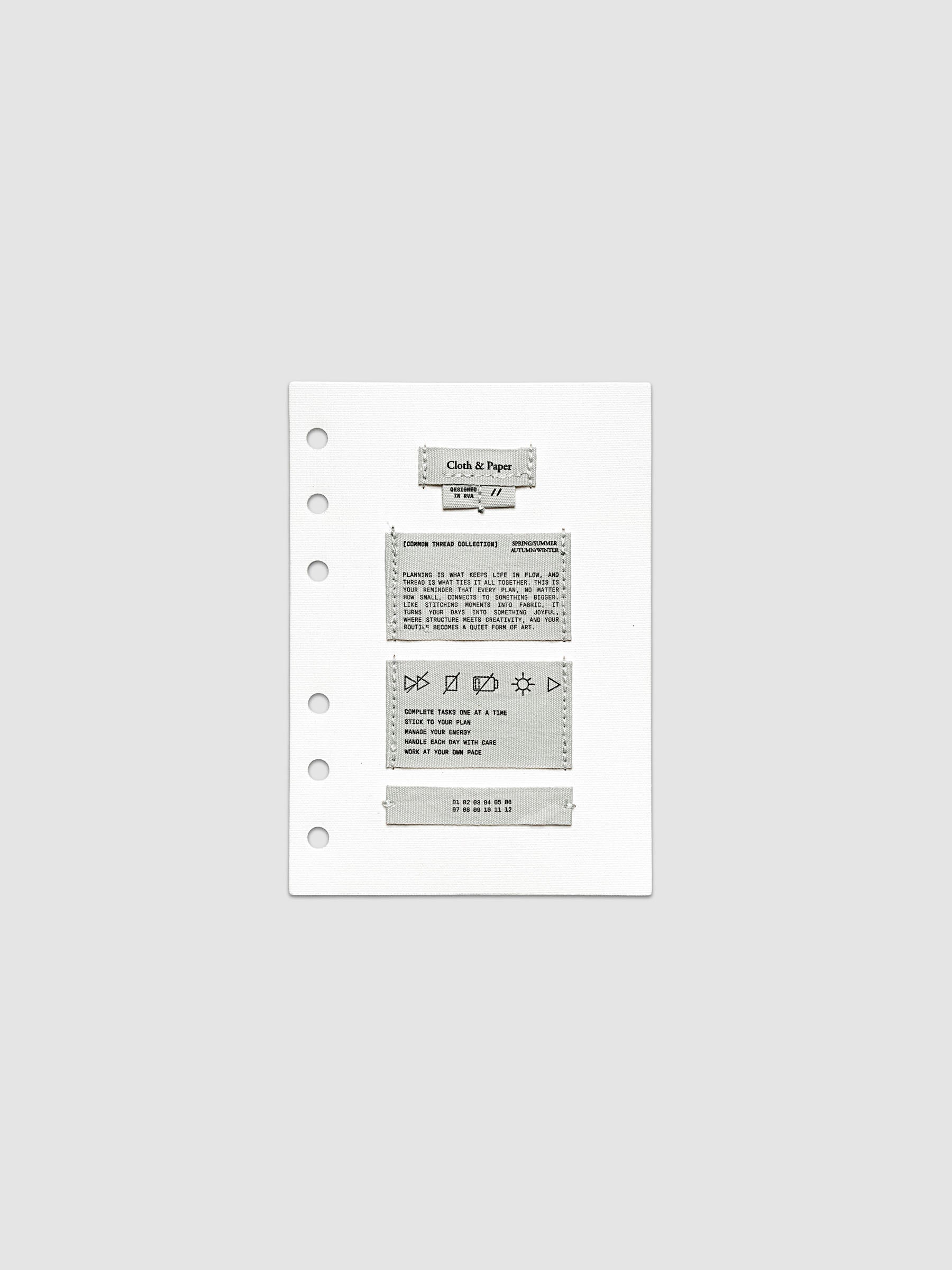 Sewn Tags Planner Dashboard shown pre-punched for 6-ring planners in size A6.