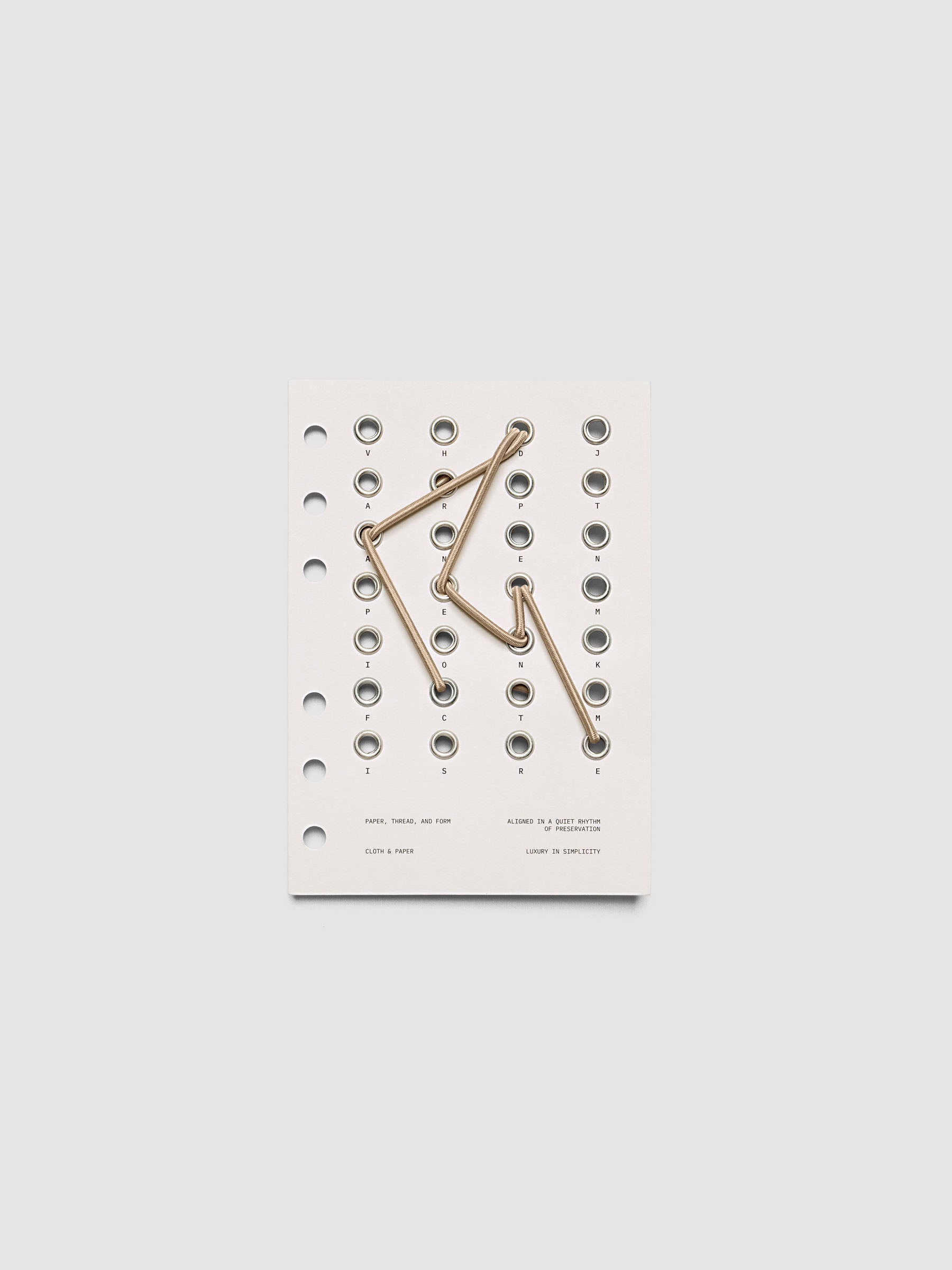 Cadence Dashboard with grommets and string on beige cardstock shown in size A6 for 6-ring planners and notebooks.