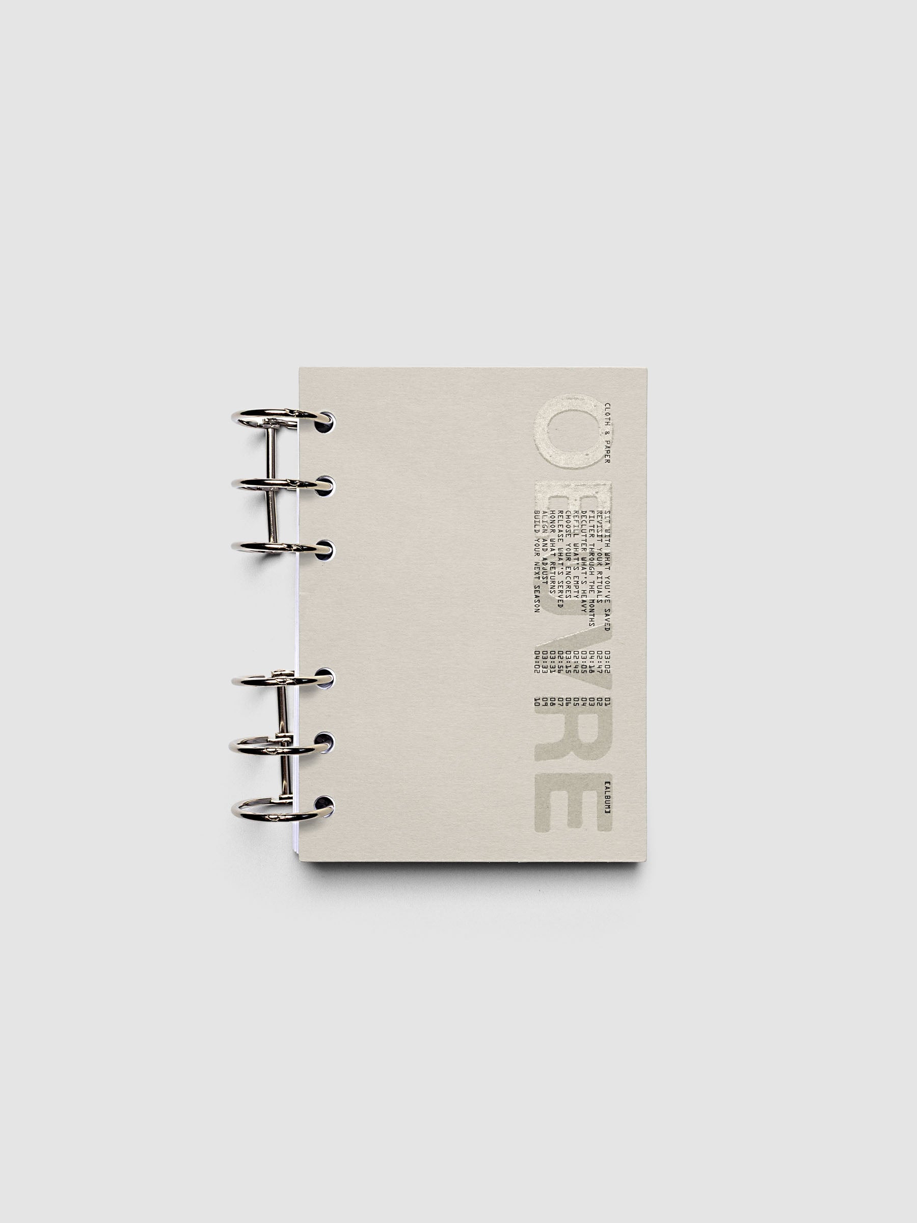 Oeuvre Planner Dashboard in A6 6-Ring Punch size shown in a planner