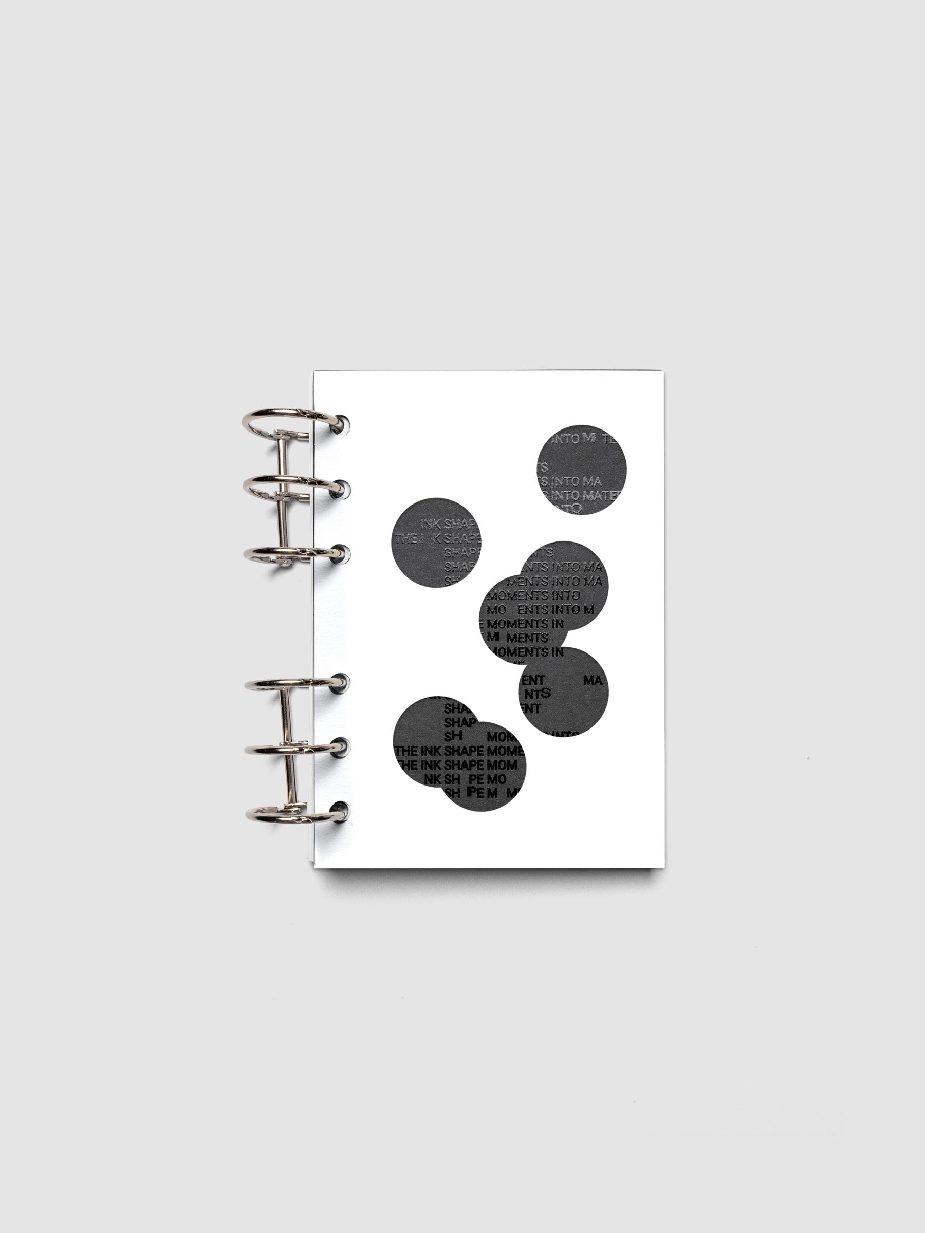 Black and white Ink Blot Planner Dashboard Duo shown layered and ring bound in size A6.