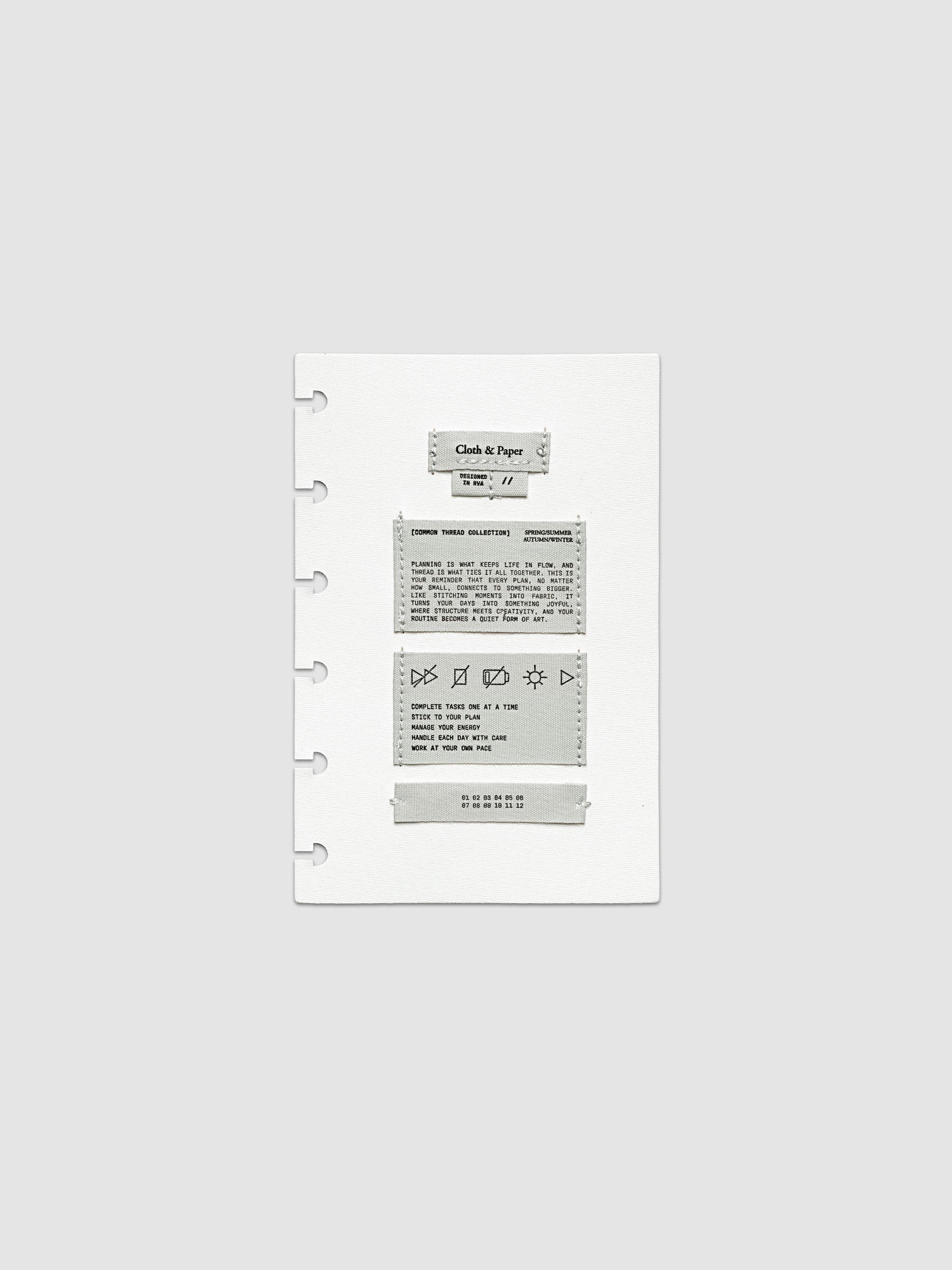 Sewn Tags Planner Dashboard shown pre-punched for discbound planners in size CP Petite.