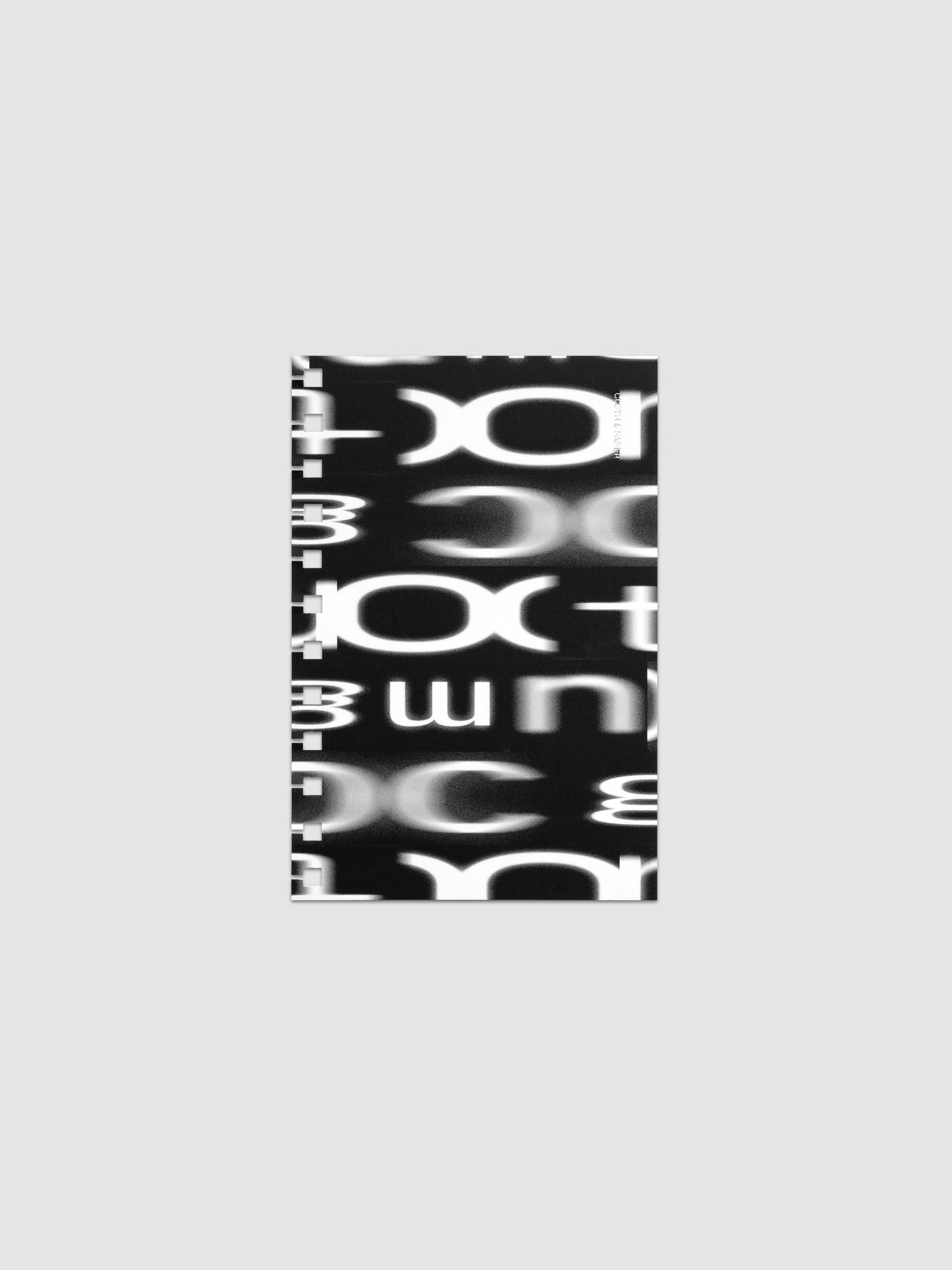 Spiral Notebook dashboard in the pattern Blurred Letters shown in size CP Petite against a neutral background.