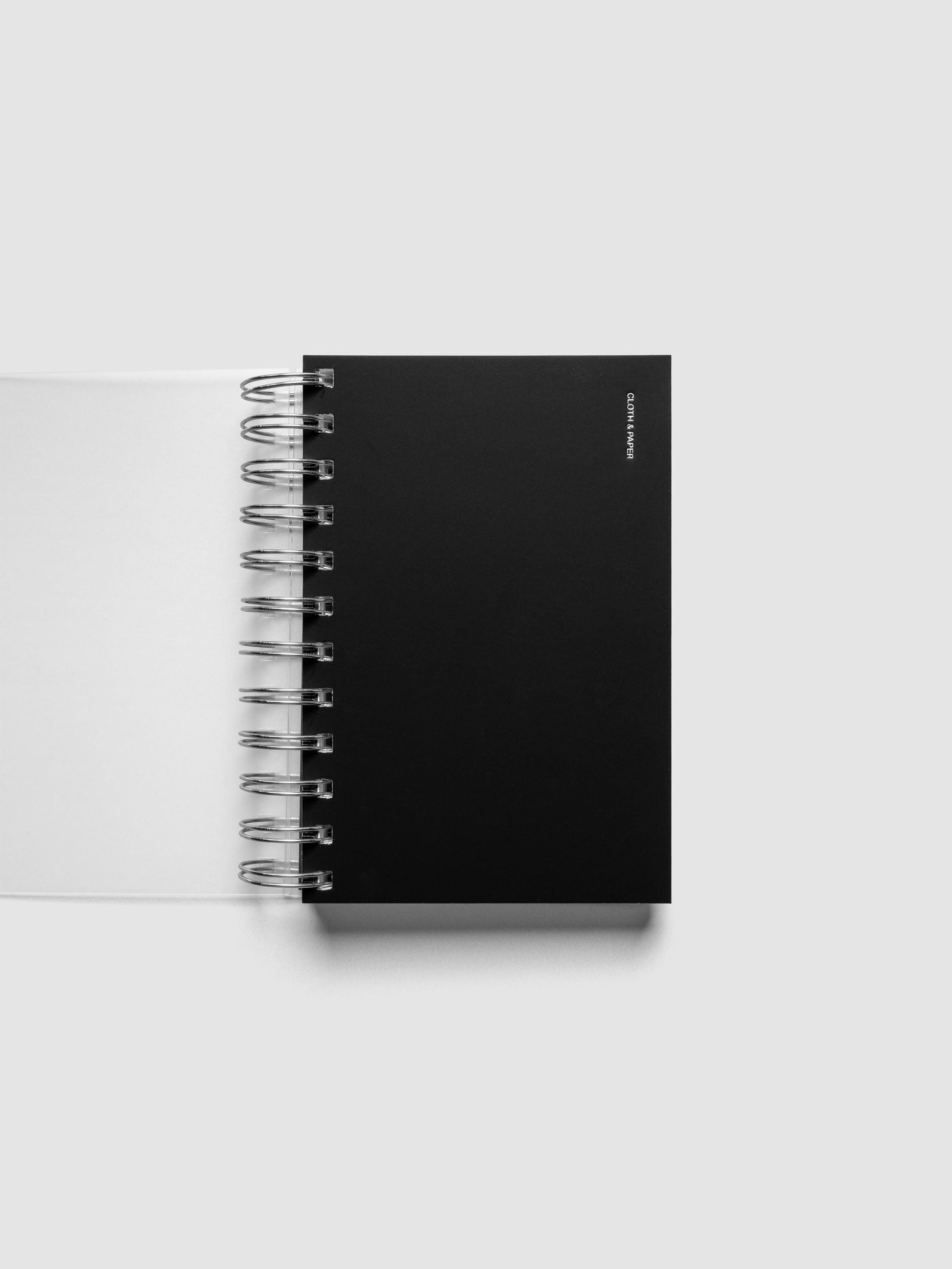 Spiral Notebook dashboard in the color Avant Garde shown in size CP Petite inside a notebook.