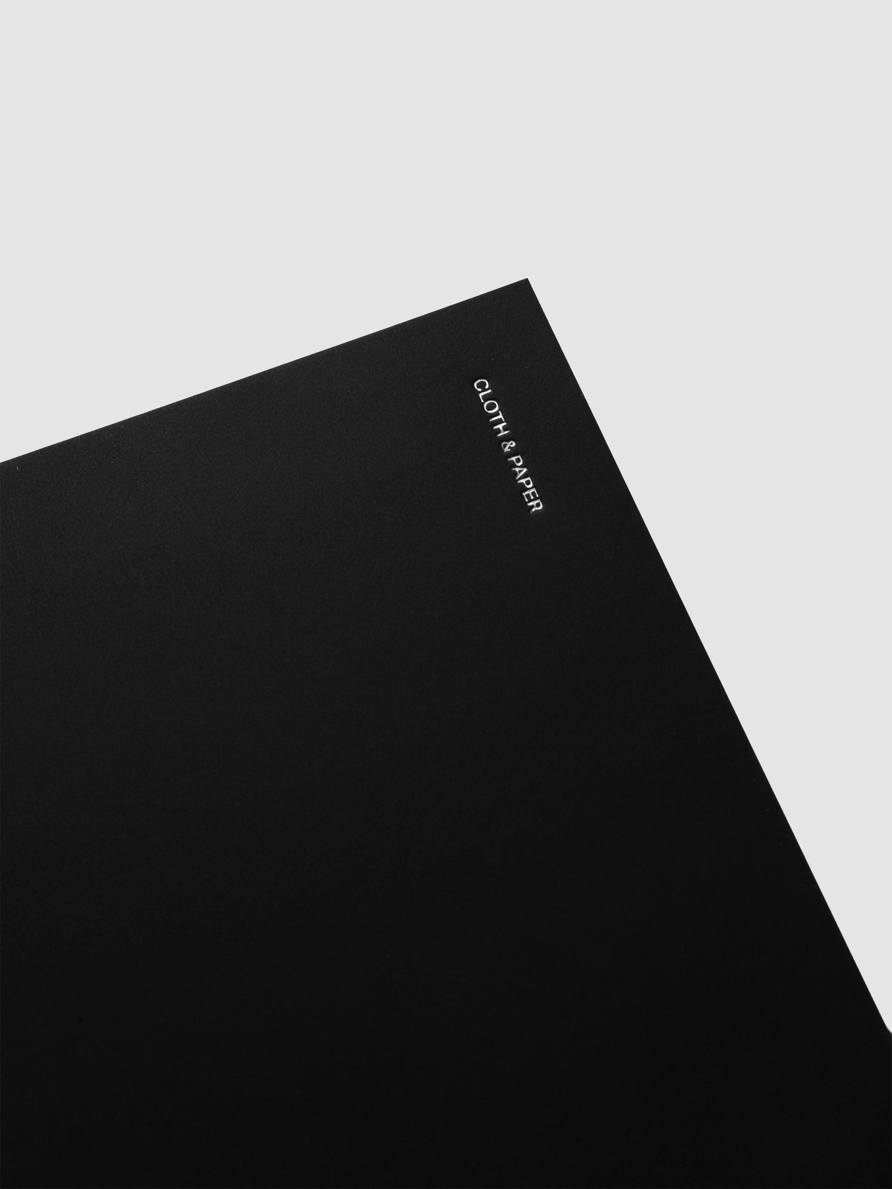 Detail view of the Spiral Notebook dashboard in the color Avant Garde shown in size CP Petite against a neutral background.