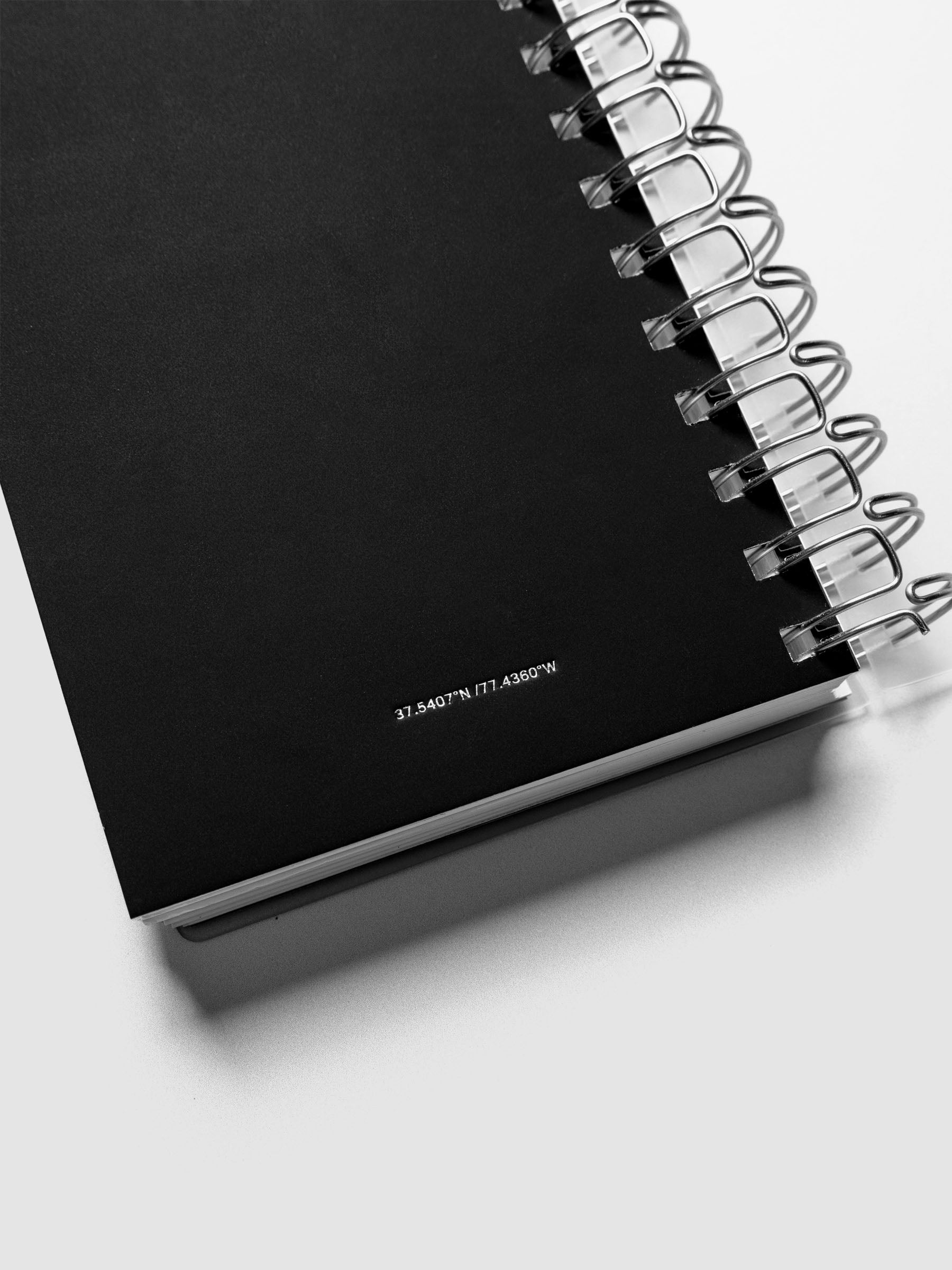 Detail view of the Spiral Notebook dashboard in the color Avant Garde shown in size CP Petite against a neutral background.