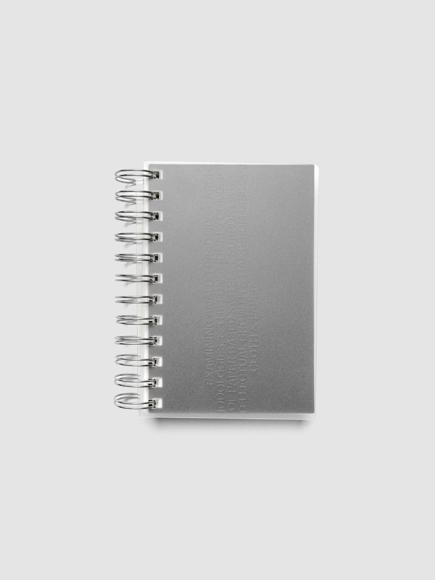 Black embossed Analog Embossed Planner Dashboard without the drop card shown in size CP Petite Spiral with the front cover overlayed.