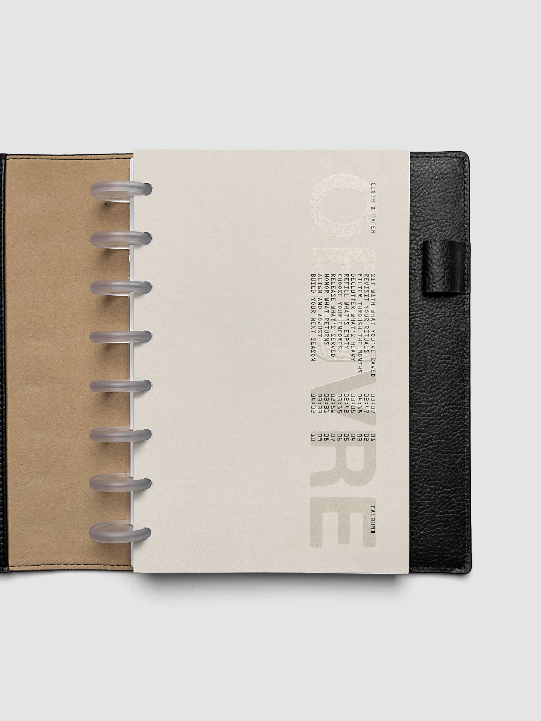 Oeuvre Planner Dashboard in Half Letter 8-Disc Punch size shown in a planner
