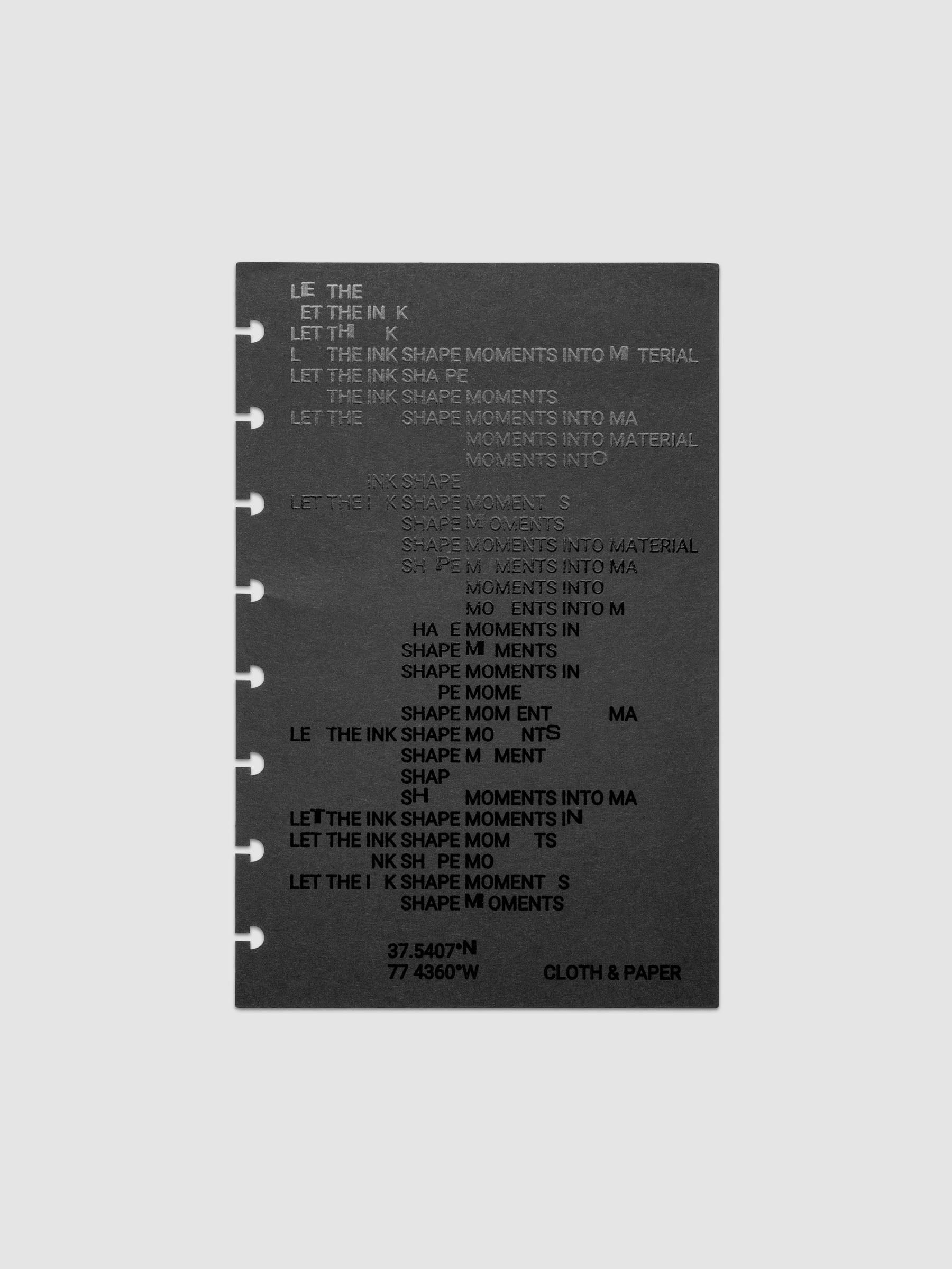Black dashboard from the Ink Blot Planner Dashboard Duo on a neutral background in size Half Letter, pre-punched for discbound planners.