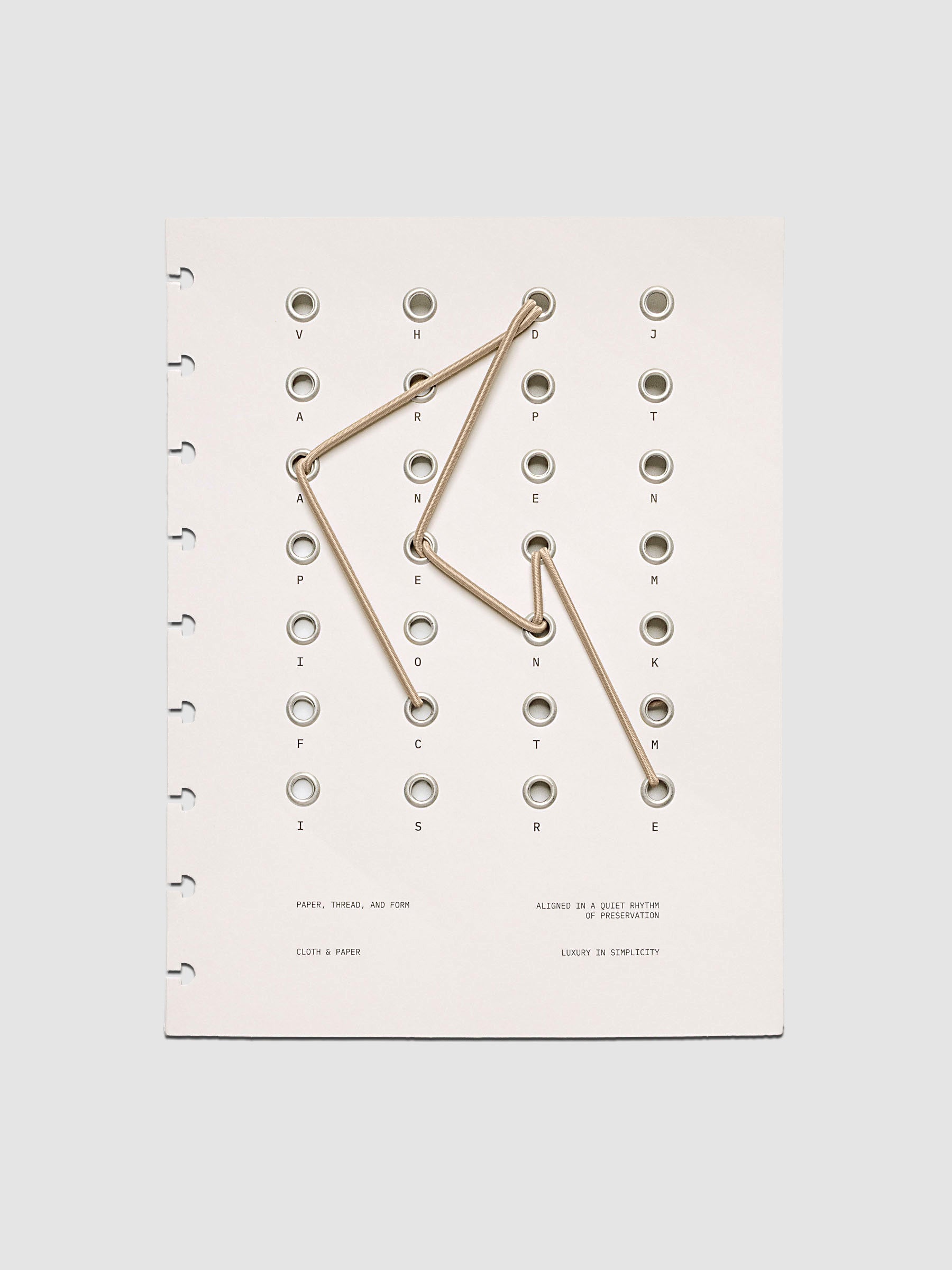 Cadence Dashboard with grommets and string on beige cardstock shown in size HP Classic for discbound planners and notebooks.