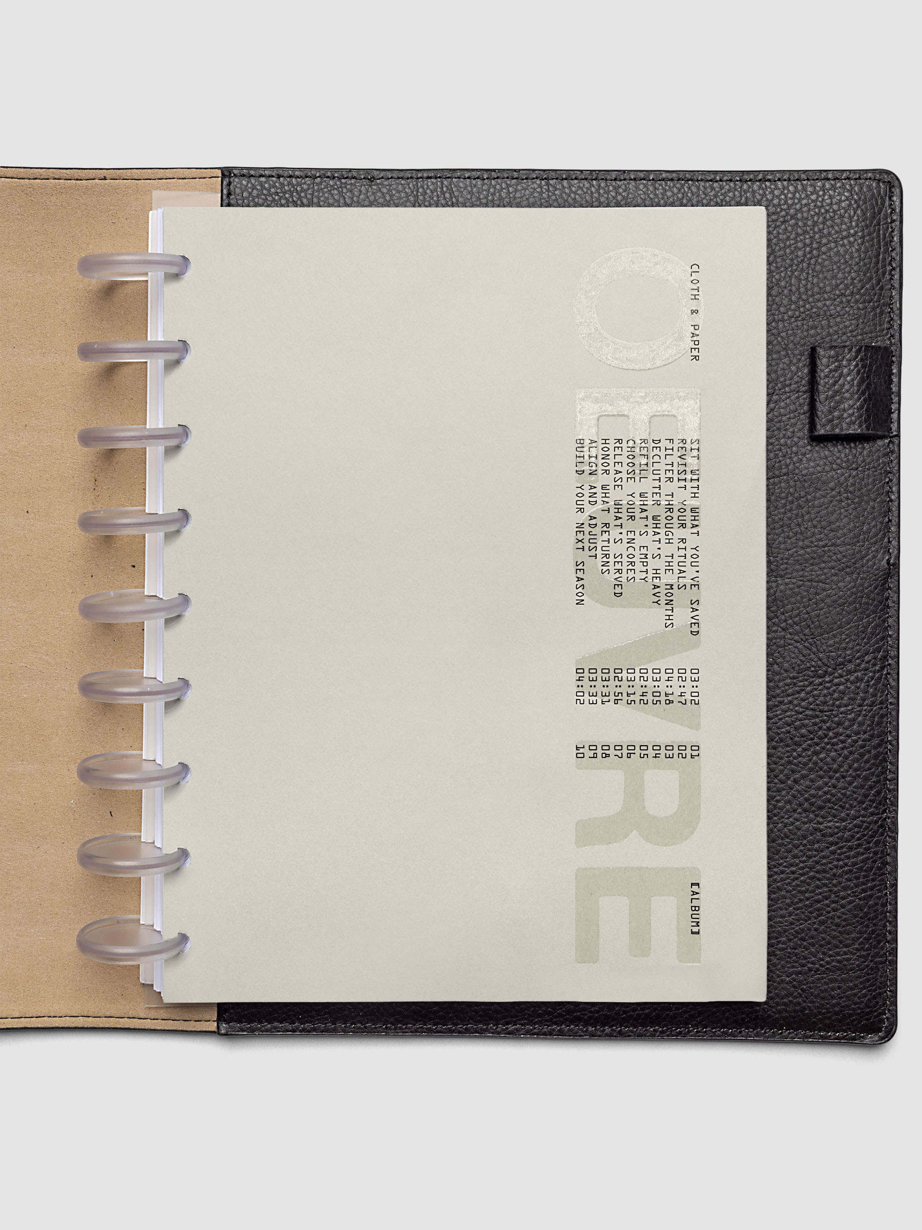 Oeuvre Planner Dashboard in HP Classic 9-Disc Punch size shown in a planner