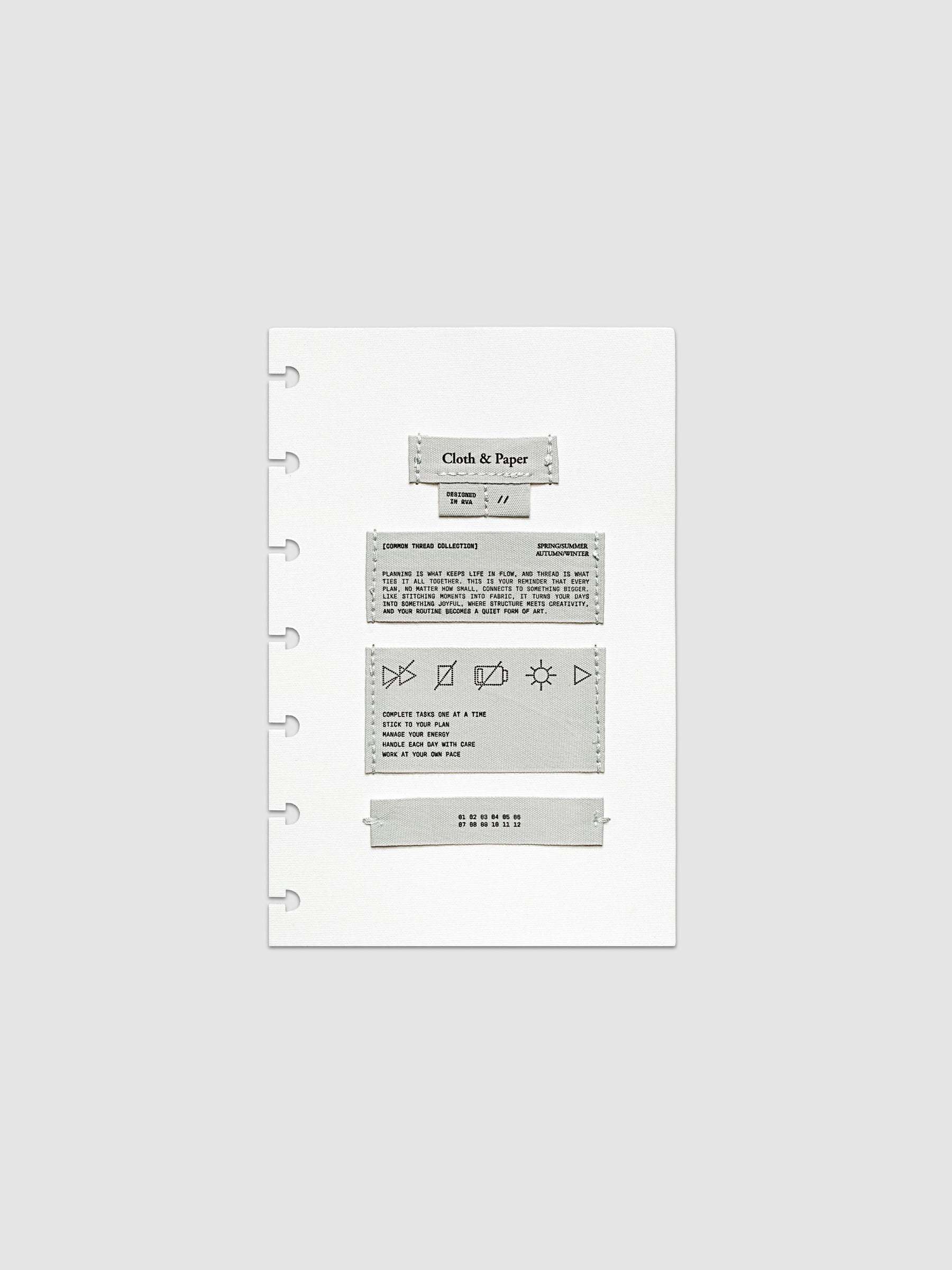 Sewn Tags Planner Dashboard shown pre-punched for discbound planners in size HP Mini.