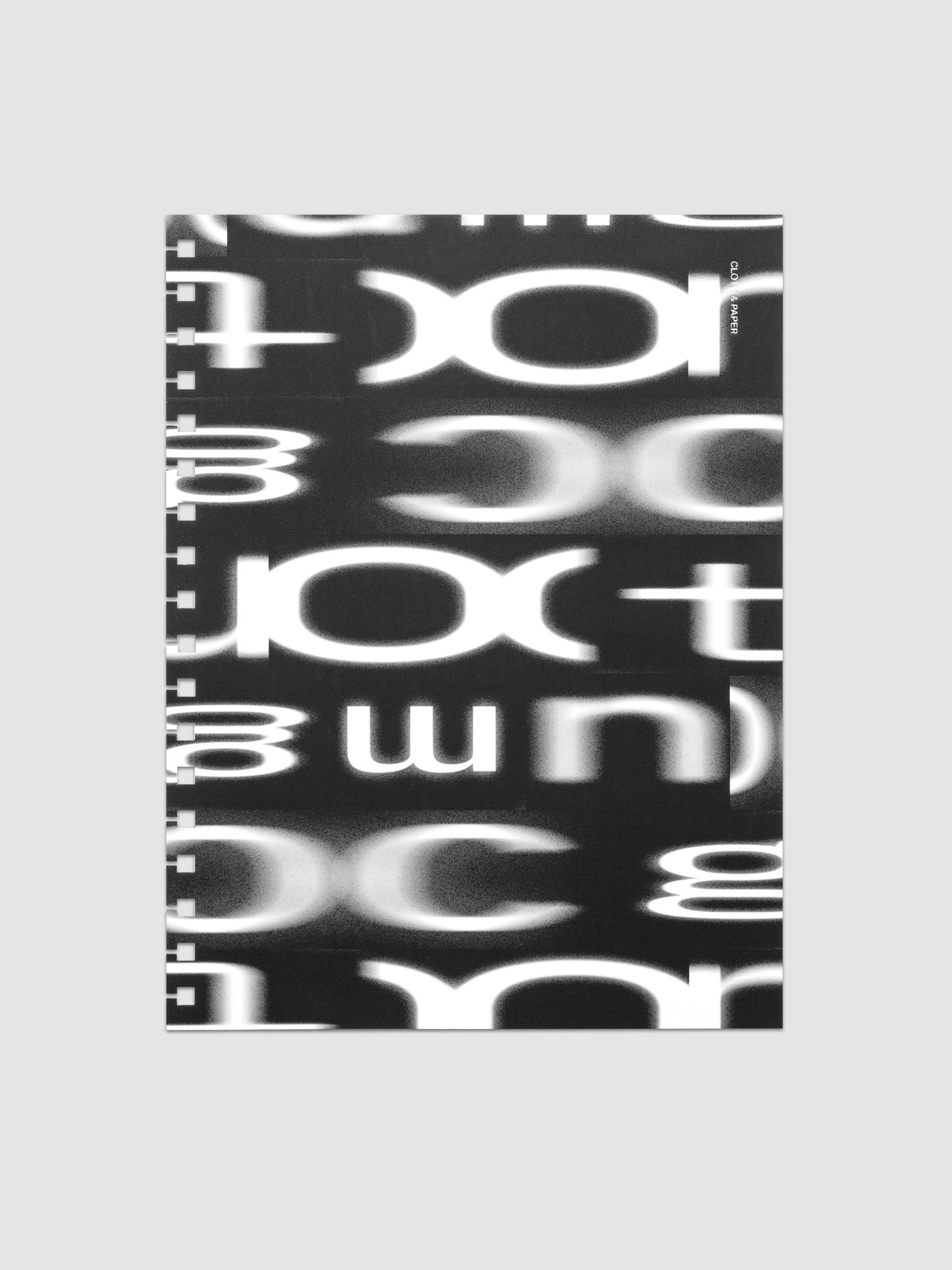 Spiral Notebook dashboard in the pattern Blurred Letters shown in size HP Classic against a neutral background.