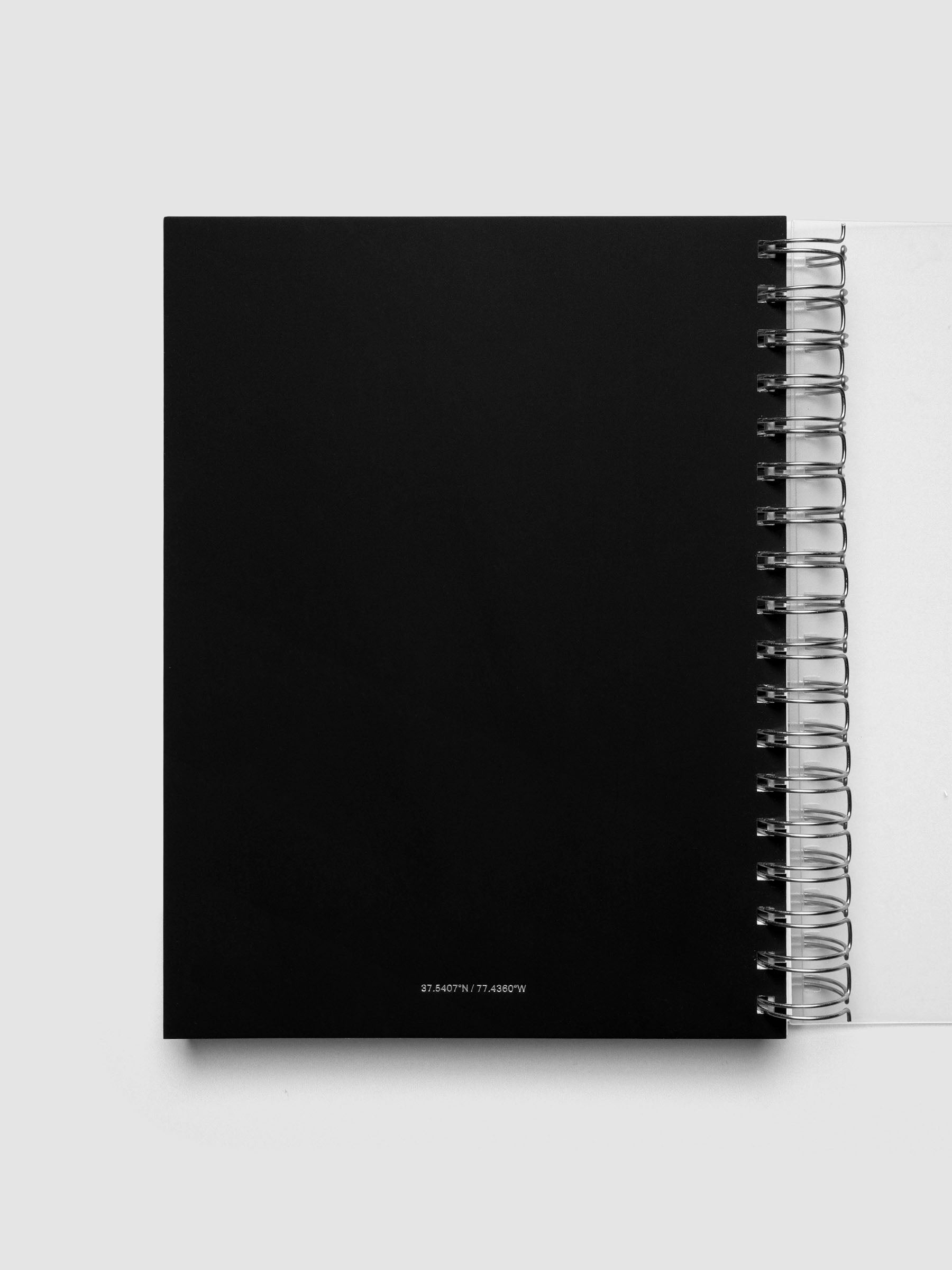 Spiral Notebook dashboard in the pattern Blurred Letters shown in size HP Classic inside a notebook.