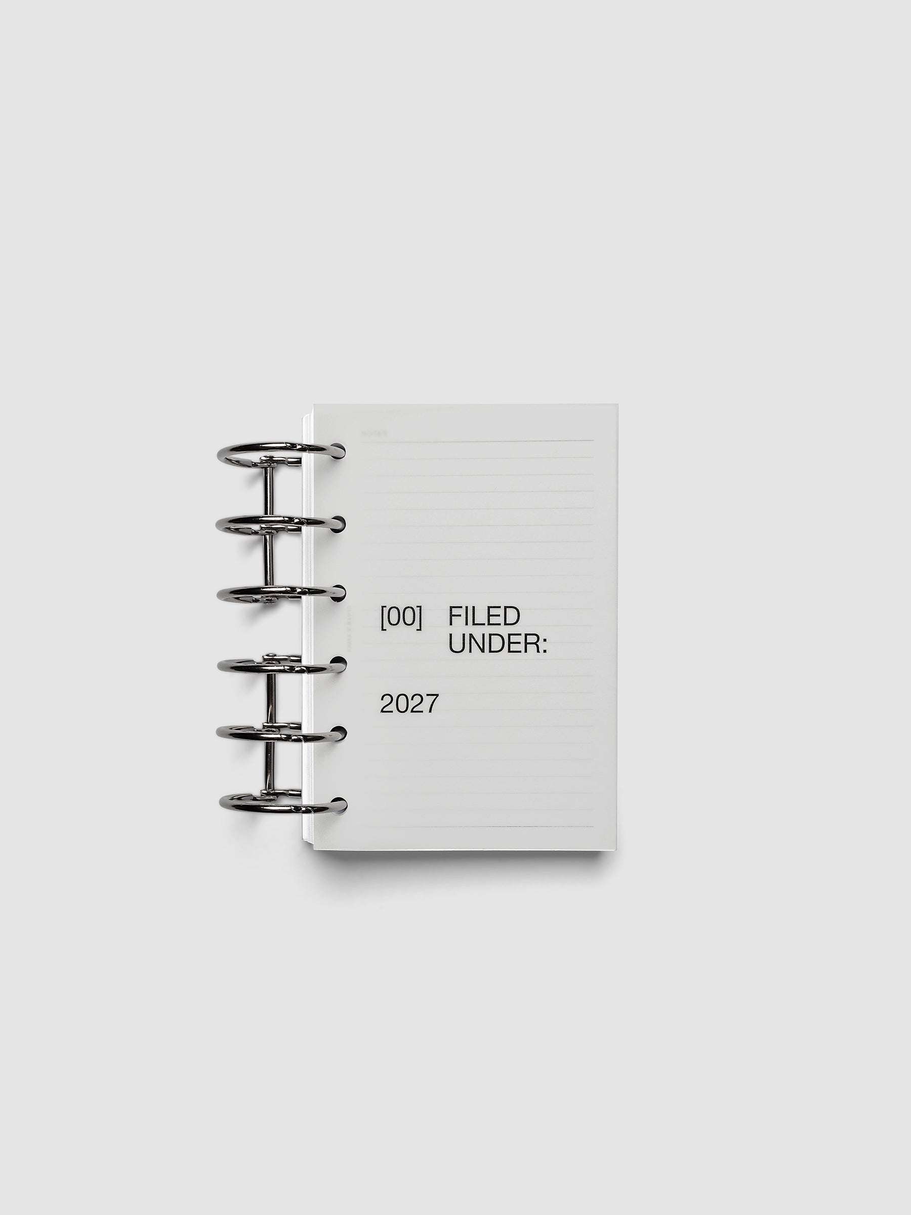 2027 Front + Monthly Dashboard Overlays, Avant Garde, Pocket 6-Ring Punch, vellum dashboard overlay shown layered inside a planner