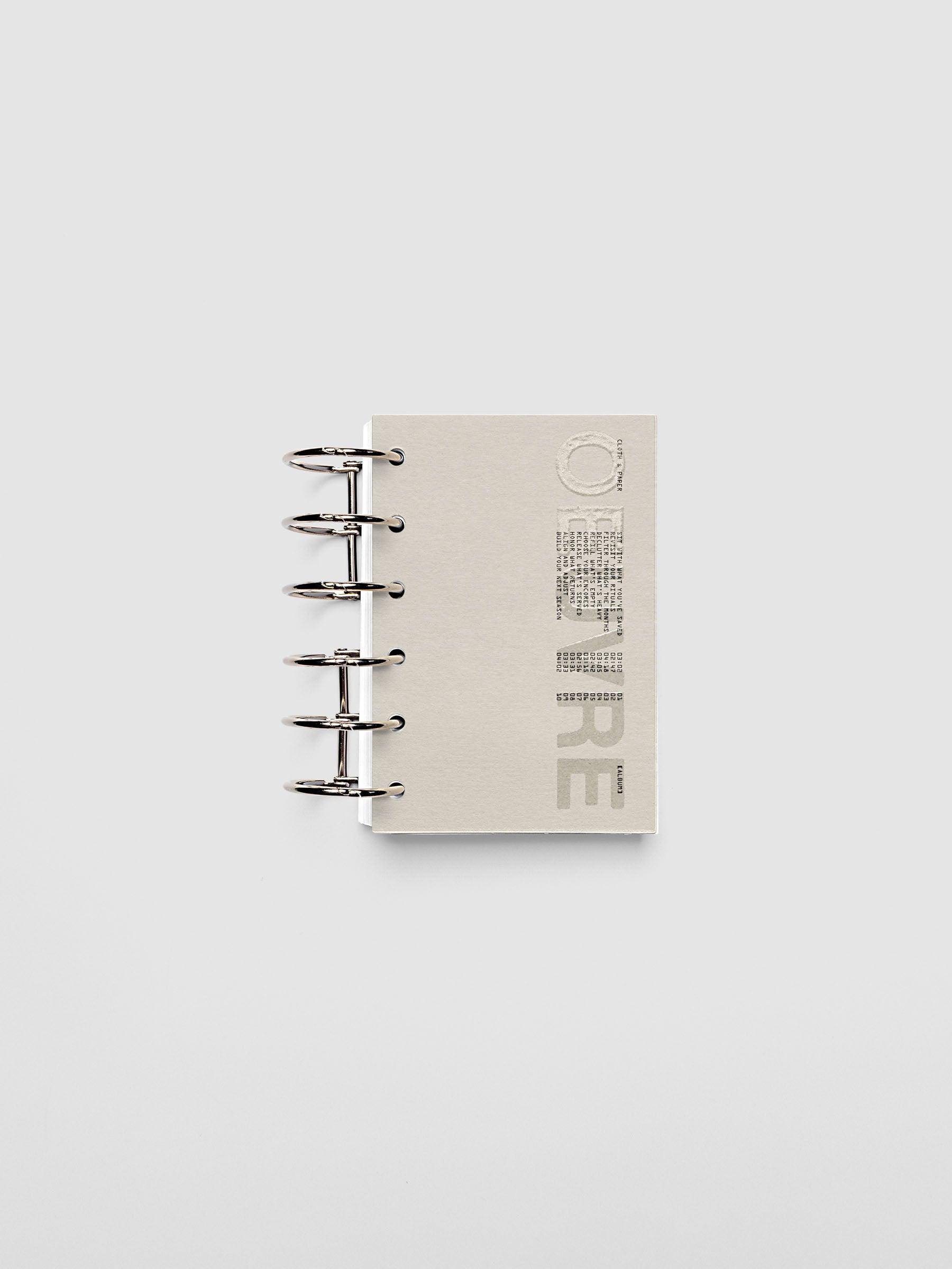 Oeuvre Planner Dashboard in Pocket 6-Ring Punch size shown in a planner