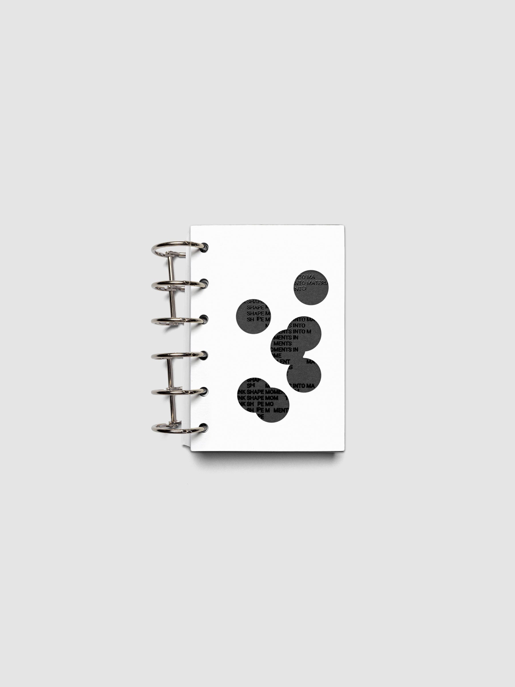 Black and white Ink Blot Planner Dashboard Duo shown layered and ring bound in size Pocket.
