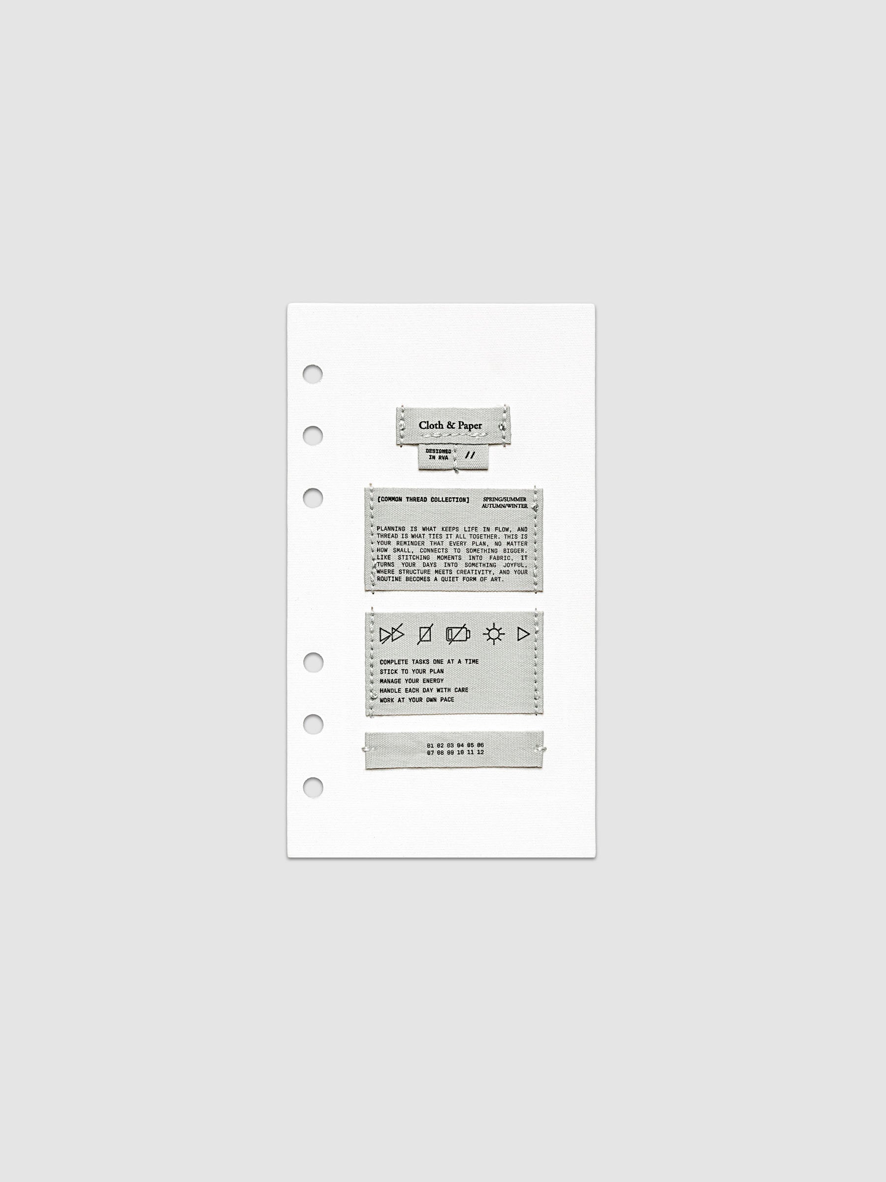 Sewn Tags Planner Dashboard shown pre-punched for 6-ring planners in size Personal.