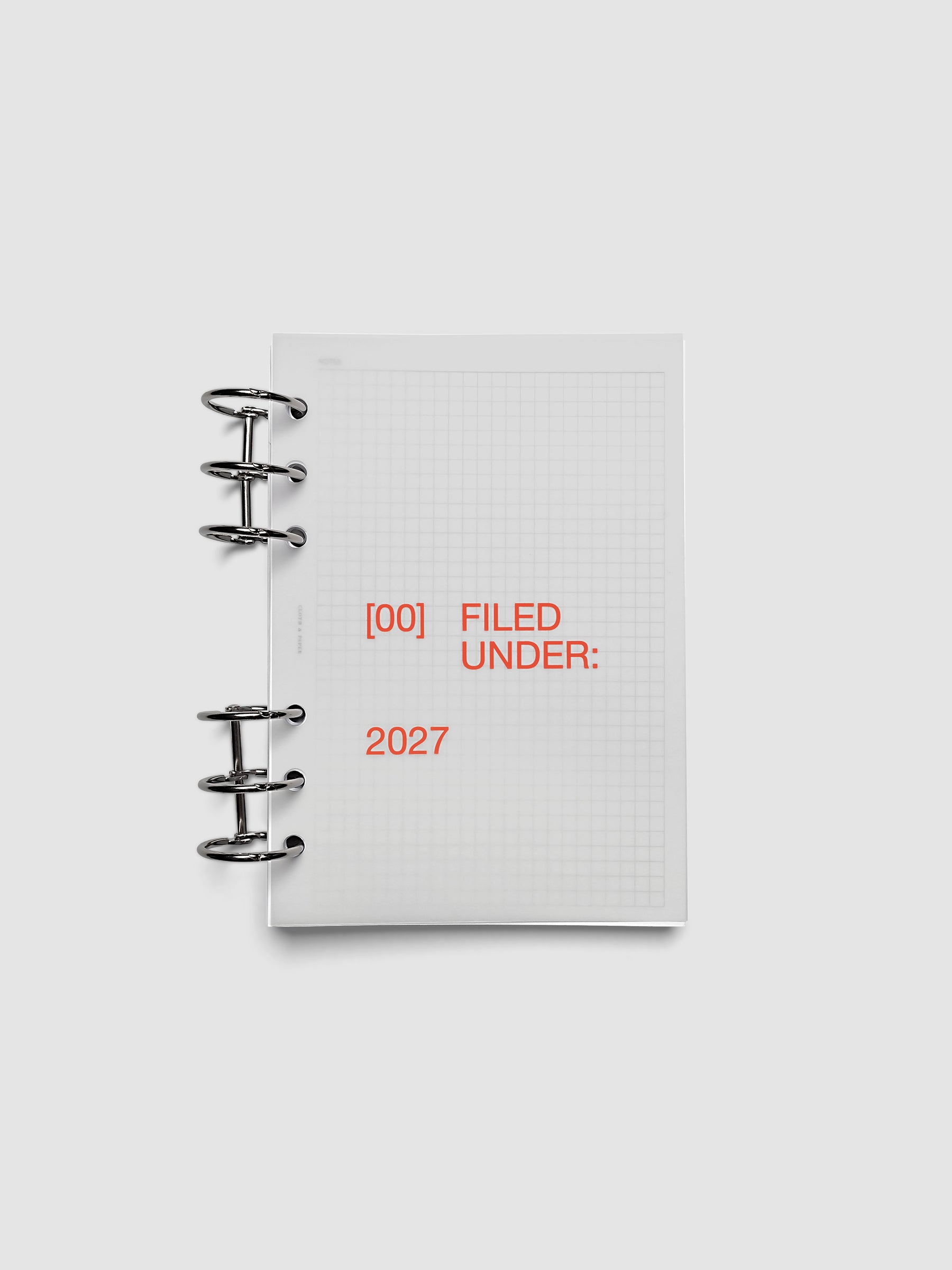 2027 Front + Monthly Dashboard Overlays, Saffron, Personal Wide 6-Ring Punch, vellum dashboard overlay shown layered inside a planner