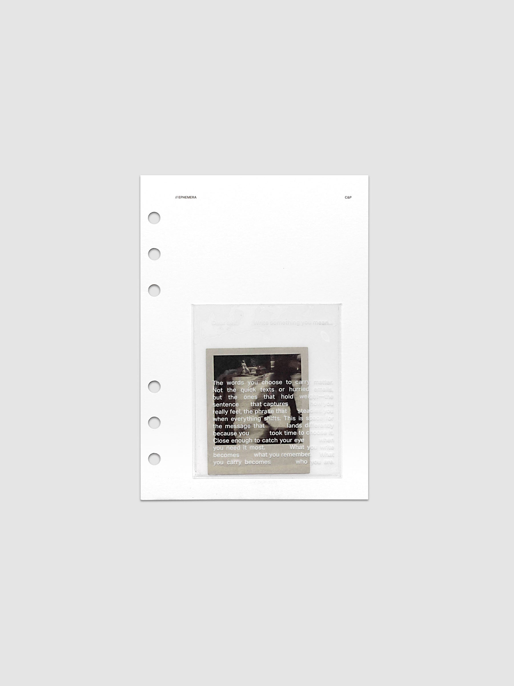 White Ephemera Planner Dashboard with transparent pocket and journaling card shown pre-punched for Personal Wide 6-ring planners.