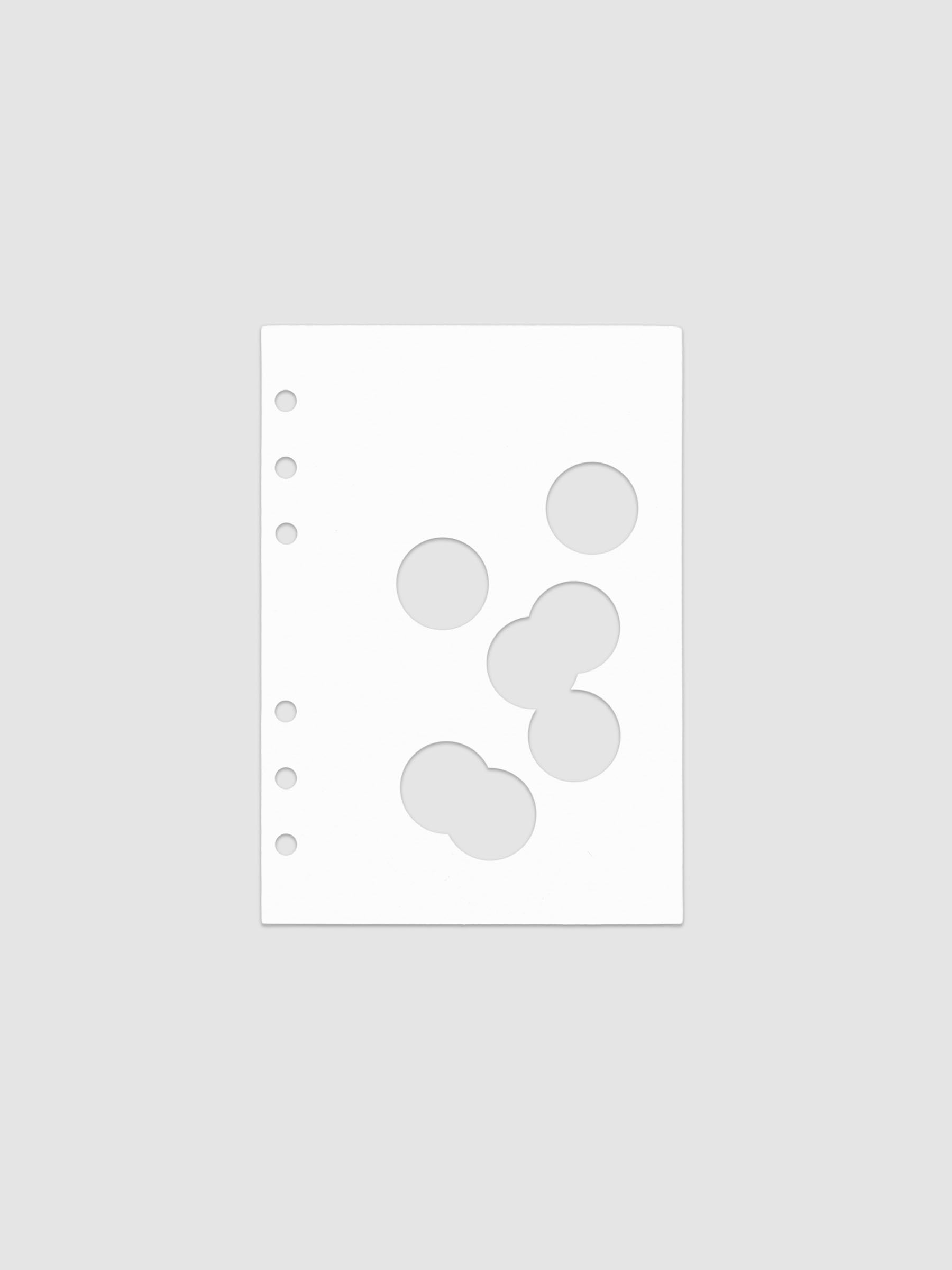 White dashboard from the Ink Blot Planner Dashboard Duo on a neutral background in size Personal Wide, pre-punched for 6-ring planners.