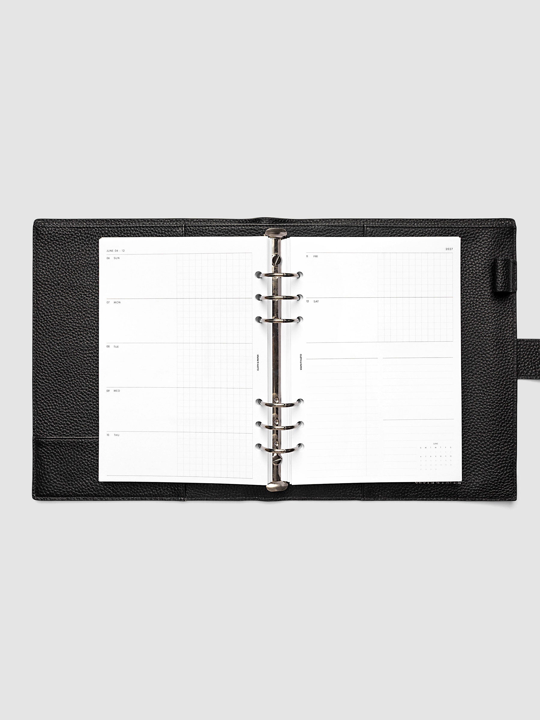 2027 Dated Weekly Horizontal Planner Inserts, Sunday Start, A5 6-Ring Punch, full week-on-two-pages horizontal spread showing each day split into open and graph columns, with tasks column, notes column, and mini monthly calendar on the right page, shown inside a planner